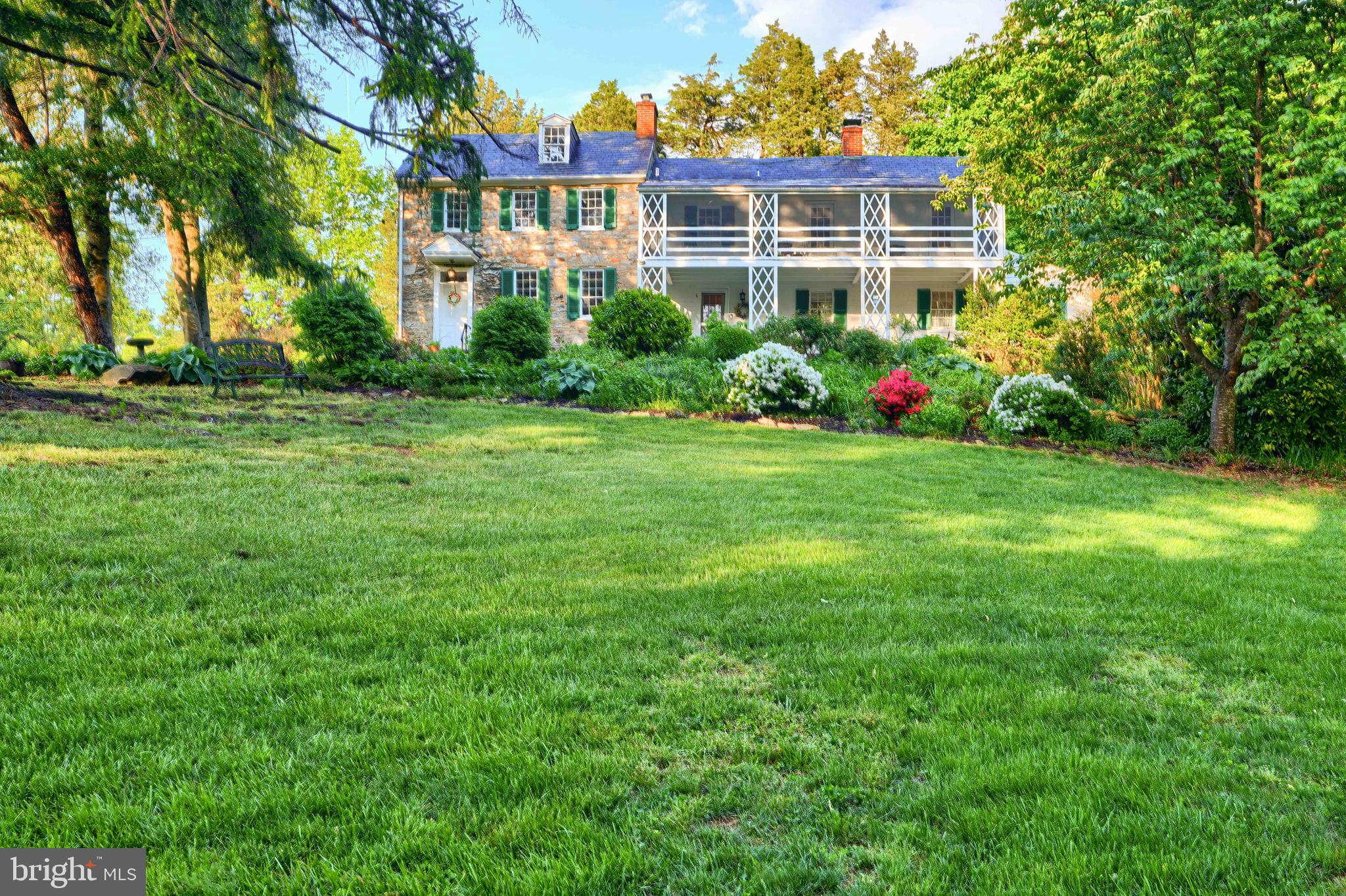 The Norris-Stirling House was built in 3 sections during the years 1804, 1840, and 1934. It has been beautifully maintained and preserved over the years. The home consists of a large slate covered porch, 4 bedrooms, 2.5 baths, a sleeping porch/balcony off the second level, 3 fireplaces (1 with wood insert), remodeled kitchen, living room, dining room and laundry on main level, finished attic, and cellar.  There are 45.55 acres of land in AG – half woods and half fields. Approximately 22 aces of the land are pastures, hay fields, and riding areas with riding trails connecting into trails along Winters Run Stream. The property is currently being used for horses and goats along with flower/vegetable gardens and grape vines. There is a 3 car detached garage with a 5 year old cedar shingle roof, 2 garage door openers and spot lights. The outbuildings include a large bank barn, run-in barn, and a 3 stall barn and tack room. The bank barn has newly installed tongue and groove pine floor and rafters, electric, and can hold farm equipment. The 3 stall horse barn has electric, water and a heat lamp. The original beams of the home have been reinforced and there is new blown-in insulation in the main house. There is upgraded 200 amp electric with a new box and Verizon Fios at the home. A concrete pad is in the rear yard with electric and water for a hot tub along with a swing set and garden patio. The property backs to Harford Glen and is on a preservation easement through the Maryland National Historic Trust. There are 5 building rights and the potential for AG preservation is available. All information should be confirmed through Harford County.
