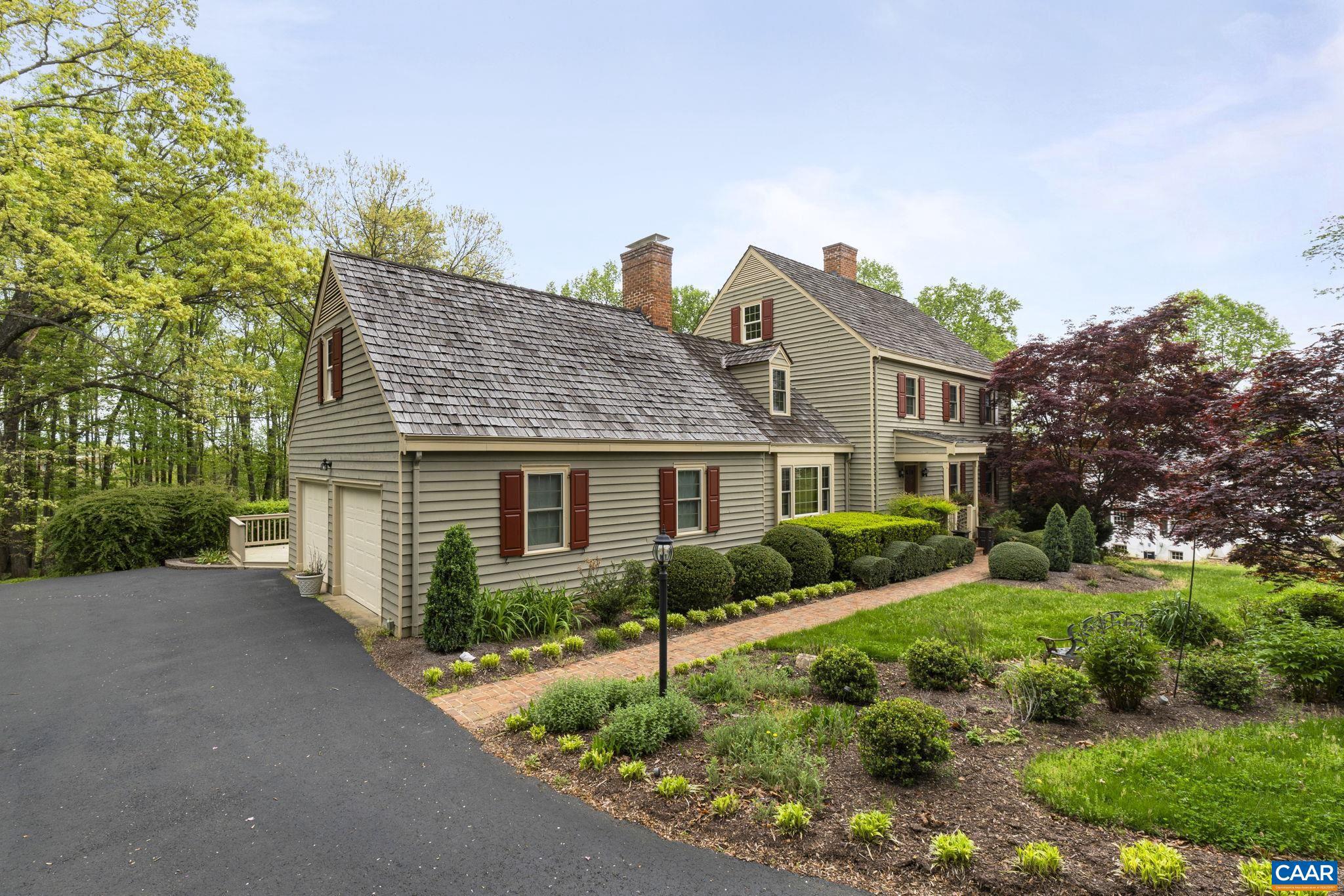 Jump into the pages of a storybook with this dreamy home set on over an acre of finely-manicured grounds in private Ednam Forest, a rare gem! You will immediately feel the warmth this home exudes the moment you arrive from the cobblestone driveway entrance, to the bright sunroom, custom cherry cabinetry in the kitchen, pegged hardwood flooring in family room, to the three brick-hearth fireplaces. This property has it all--six bedrooms + a bonus room with cedar-lined closets, an additional kitchen on the walkout terrace level for endless possibilities, mudroom connecting the oversized garage, built-in shelving, walk-up attic for storage, multi-level laundry chute, central vac & intercom systems, and even an apple tree in the backyard! Relax & admire the mountain views from your primary suite balcony as well as many other upper-level windows. Stroll along the scenic trails that pass a duck pond or explore farther to Ragged Mtn Reservoir. Truly a magnificent property, lovingly maintained, not to be missed! Steps away from Boar?s Head Resort & Spa and Birdwood Golf Course. Minutes to UVA & shopping.,Cherry Cabinets,Cutting Board,Solid Surface Counter,Wood Cabinets,Fireplace in Bedroom,Fireplace in Family Room,Fireplace in Rec Room