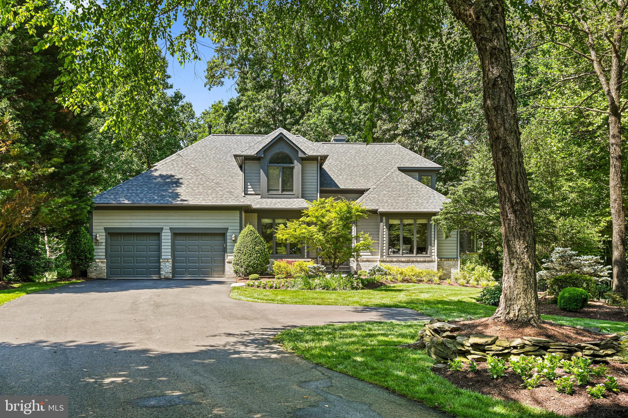 Beautiful Gulick Group PRESCOTT model located in a quiet enclave at the top of Bright Pond Lane.
Located on a 1.63 acre lot, this special property features a private heated swimming pool and backs to gorgeous, private woods. Inside, the transitional floor plan features a spacious dining room, perfect for entertaining, and a flexible room which can be used either as a library or a more formal living room. Continue into the generously sized family room with a wall of windows and featuring (just replaced) skylights, a gas fireplace and built-in display shelving. The kitchen opens to this space and is clearly designed for cooking! Preparing a gourmet meal or even a quick snack will be a treat. The circular breakfast room overlooks both the pool and a wooded view. The primary suite is located on the main level and just wait until you see the beautifully updated full bathroom! The custom walk-in closet provides plenty of space and opportunity for beautifully displayed and organized clothing. Upstairs is another fully updated full bathroom and 2 large bedrooms. There is additional loft space on this level which would make a great workout area, play area or even an opportunity to add another suite. Continuing to the lower level, you will find a family room that features a wet bar and access to the pool. There is an area off of the family room that could be used as another office, sitting area or a game area. This level features a large 4th bedroom, perfect as an in-law or au pair suite, and an updated full bathroom. There is a TON of storage space in this house! At the same time there is an opportunity to use some of this space to create something unique. Always wanted a media room or wine cellar? This is the perfect space. Maybe a dance studio or exercise room? Plenty of options here! Even with this expansive lot in a quiet community, this home belongs to the Reston Association and all of the associated amenities. Enjoy community pools, tennis courts, pickleball courts and the extensive path system that surrounds the neighborhood. This amazing location is close to Reston Town Center, North Point Village Center and Tysons Corner. Be at Dulles Airport in 10 minutes! If you have been looking for that special home, you have found it! New roof and skylights (May 2024), refinished hardwoods (May 2024), resurfaced pool and update of surrounding area (2021). Video and photos have been added.