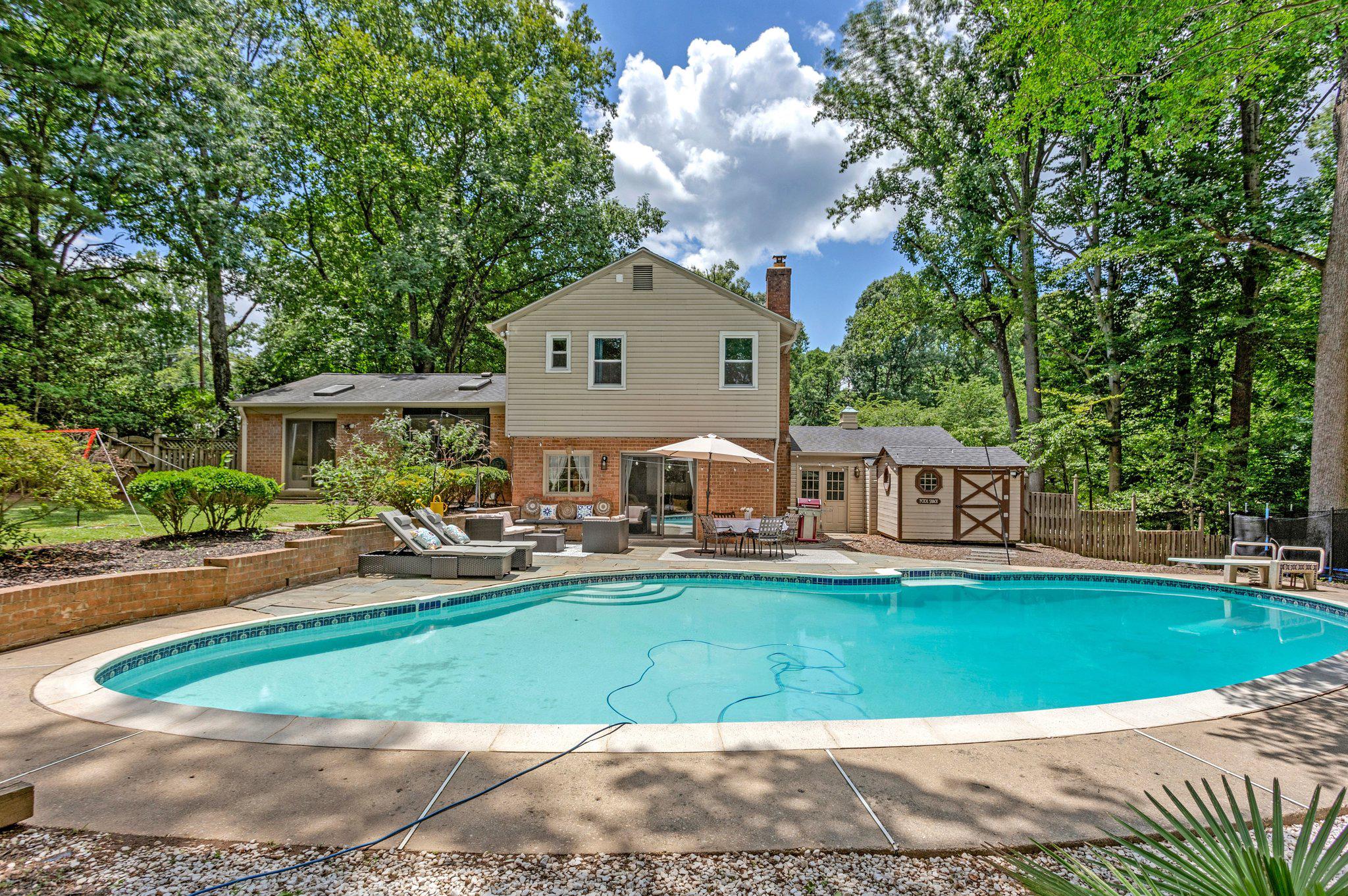 Rarely available in Luxmanor/Tilden Woods, this beautifully updated 5-bedroom, 3.5-bath home offers a private in-ground pool, expansive .43-acre yard, oversized two-car garage, and over $70,000 in recent improvements. This residence seamlessly combines comfort, style, and modern updates.

The spacious living and dining areas are filled with natural light from five skylights, creating a warm and inviting atmosphere. The updated kitchen features stainless steel appliances, granite countertops, new luxury vinyl plank flooring, and views of the beautifully landscaped backyard.

Step outside to your own private oasis. The fully fenced backyard features a custom in-ground pool and expansive lawn area for recreation and outdoor entertaining—an exceptional and rare combination in this neighborhood. Whether you're relaxing poolside or hosting family and friends, this outdoor space is sure to impress.

The upper level offers four bedrooms, including a spacious primary suite with a custom walk-in closet featuring a closet organizer (2024) and a renovated en-suite bathroom (2024). The fully finished lower level provides flexible living space with a recreation room, new wet bar (2024), full bath, and an additional room ideal for a home office, gym, playroom, or guest suite.

Recent improvements include 12 double-pane windows (2024), an electrical heavy-up (2024), attic insulation (2024), extensive landscaping and hardscaping, a newer roof, gutters, and driveway.

Ideally located near Montgomery Mall, Pike & Rose, Wildwood Shopping Center, Cabin John Village, Cabin John Park, Tilden Woods Park, Metro, and major commuter routes including I-270 and I-495. Enjoy easy access to shopping, dining, recreation, top-rated Montgomery County schools (Luxmanor ES, Tilden MS, Walter Johnson), and Lycée Rochambeau.