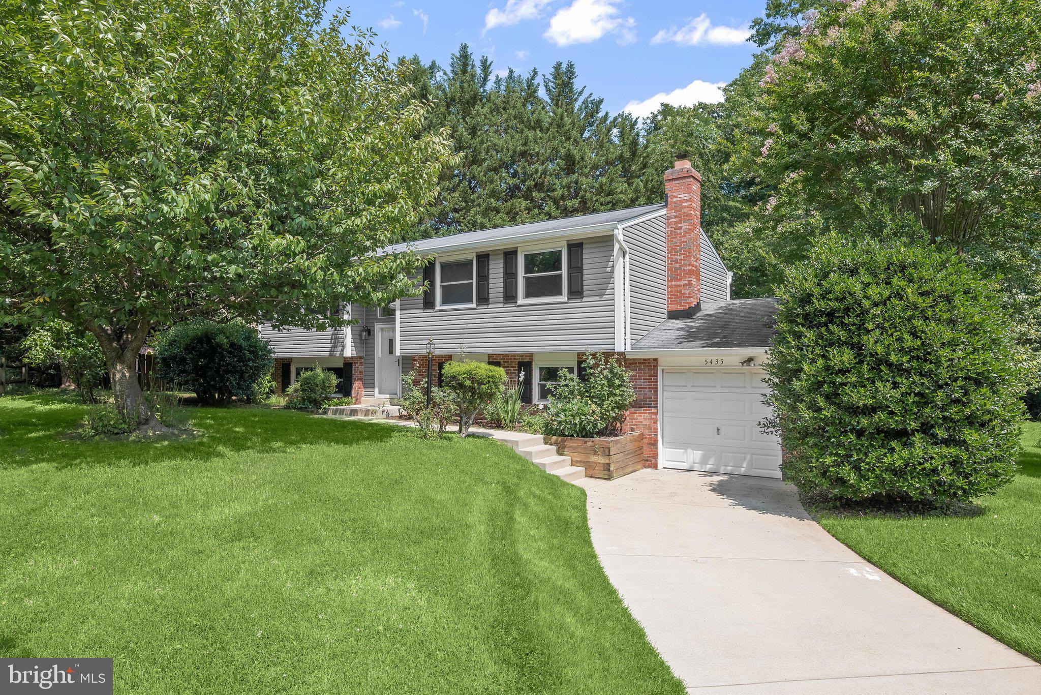 Nestled in the highly sought-after Village of Harper’s Choice in Columbia, this beautifully updated home offers the perfect blend of style, comfort, and convenience. Surrounded by pristine landscaping, the classic brick and vinyl exterior creates an inviting first impression from the moment you arrive.  A welcoming split-foyer design leads to the main level, where an open-concept living area is highlighted by rich hardwood flooring, elegant chair railing, and a neutral color palette that flows seamlessly throughout. The adjoining dining area connects effortlessly to the stunning kitchen, creating an ideal setting for both everyday living and entertaining. The kitchen showcases 36-inch shaker-style cabinetry with soft-close drawers, quartz countertops, sleek appliances, and a peninsula that provides additional prep space and casual seating.  Retreat to the spacious primary suite featuring continued hardwood flooring, a double-door closet, and a beautifully updated en-suite bath complete with a walk-in shower, modern vanity, and updated lighting. Two additional bedrooms and a well-appointed hall bath complete the main level.  The fully finished lower level expands the living space with a generous recreation room centered around a brick-surround electric fireplace, creating a warm and inviting atmosphere. A fourth bedroom offers flexibility for guests, a home office, or multigenerational living. The lower level also provides direct access to the one-car garage and the rear patio, perfect for outdoor relaxation.  Ideally located near major commuter routes including US-29, MD-32, I-95, and I-70, this exceptional property offers convenient access to Baltimore, Washington, D.C., and beyond. Enjoy all that Columbia has to offer with nearby attractions including The Mall in Columbia, Merriweather Post Pavilion, Columbia Association gyms and pools, and Cedar Lane Park, and an abundance of  surrounding trails, providing endless opportunities for biking, running, and outdoor recreation.