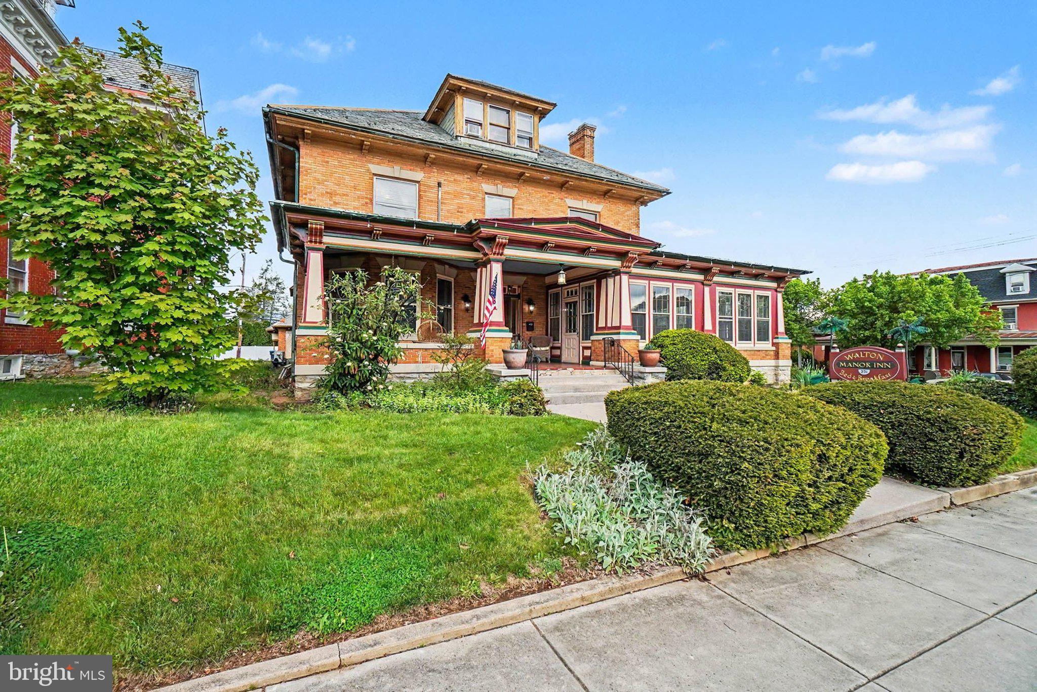 Welcome to Walton Manor Bed & Breakfast, a stunning historic property located on a prominent corner lot in the heart of Palmyra. Offering nearly 6,000 square feet of charm and character, this beautifully maintained home combines timeless elegance with modern updates, making it an exceptional opportunity for an established bed & breakfast or unique residential retreat.

Inside, you’ll find gorgeous hardwood floors, five spacious bedrooms, four full bathrooms, and a convenient half bath on the main level. The home features expansive gathering spaces perfect for entertaining guests, relaxing with family, or hosting special events. A private laundry room adds everyday convenience. For added guest comfort, the home has been updated with mini-split units in each bedroom, allowing for personalized climate control throughout the property. The home also features two separate staircases, allowing for convenient and quiet access between floors.

The third-floor apartment offers incredible flexibility with its own private entrance, bedroom, kitchen, and full bathroom — ideal for owner accommodations, extended stays, or additional rental income.

Guest bathrooms have been tastefully updated with tile flooring, tiled showers, and sleek glass sliding doors. The basement includes a workshop and multiple storage rooms, providing plenty of functional space for business operations or personal use.

Outside, the original carriage house serves as the perfect garage for additional storage or covered parking. The property features four paved parking spaces along with two covered parking spaces located in front of the garage for added convenience.

The sale includes all furnishings, artwork, appliances, linens, and dining ware, allowing for a truly turnkey opportunity.

Showings are best accommodated midweek. Contact us today to schedule your private tour of this one-of-a-kind property!