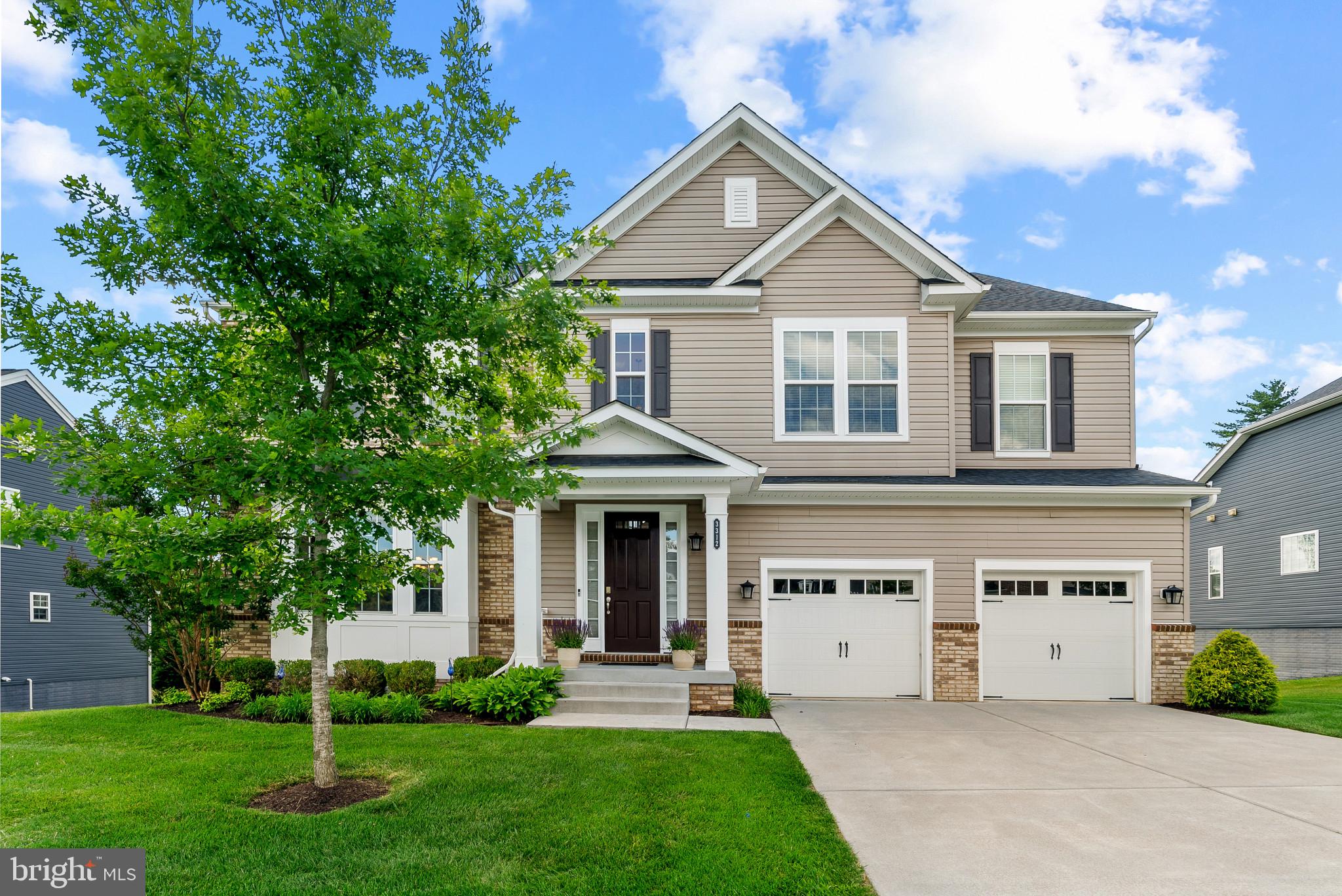 OPEN HOUSE, Sunday, June 14th from 1 pm to 3 pm!  Nestled on one of the most desirable lots in sought-after Old Court Crossing, this stunning home offers luxury, space, and exceptional craftsmanship throughout. Impeccably maintained by its original owners, this residence showcases thoughtful upgrades, elegant finishes, and a private setting backing to open space.

Step inside the grand two-story foyer, where hardwood floors lead you into the spacious formal dining room, perfect for hosting holiday gatherings and special occasions. The dramatic two-story family room is the centerpiece of the home, featuring a soaring wall of windows that floods the space with natural light and a cozy gas fireplace. Open to the family room is a fabulous gourmet kitchen designed for both everyday living and entertaining, complete with a large center island accented by upgraded pendant lighting, white shaker cabinetry, granite countertops, double ovens, two sinks, two dishwashers, stainless steel appliances, a generous breakfast area, and a convenient butler's pantry connecting to the dining room.

The main level also offers a highly sought-after first-floor bedroom with a walk-in closet, a full bath, and a mudroom located just off the two-car garage, providing flexibility for guests, multigenerational living, or a private home office.

Upstairs, the open hallway overlooks the family room below, creating an airy and inviting feel. The luxurious primary suite features a tray ceiling, his-and-her walk-in closets, and a spa-inspired en suite bath with a soaking tub, oversized shower, and double vanity. Three additional bedrooms complete the upper level, including two bedrooms connected by a Jack-and-Jill bath and a private guest suite with its own en suite bath. A conveniently located upper-level laundry room adds everyday convenience.

The fully finished walk-out lower level offers an incredible amount of additional living space, including a spacious recreation room, two additional bedrooms, and a full bath. Sliding glass doors lead directly to the spectacular custom paver patio featuring a built-in fire pit, creating the perfect setting for outdoor entertaining year-round.

Enjoy peaceful mornings and evening sunsets from the large composite deck off the kitchen, complete with steps leading down to the patio and beautifully landscaped backyard. Backing to open space, the private rear yard provides a serene retreat rarely found in today's market.

Perfectly located with easy access to downtown Baltimore, major commuter routes, shopping, dining, and everyday conveniences, this exceptional home combines luxury, functionality, and location. A truly rare opportunity in Old Court Crossing.