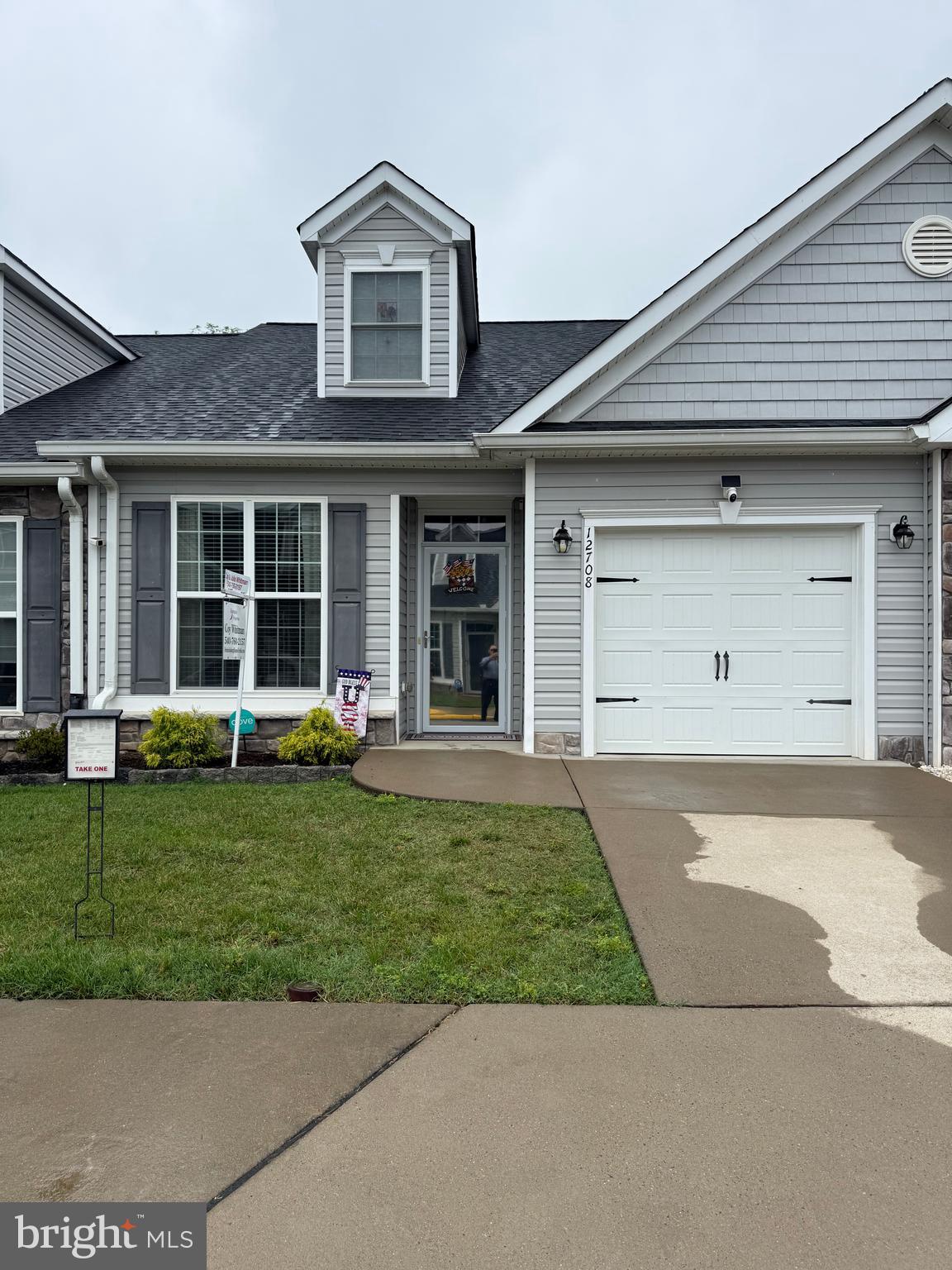 A real beauty.  Located in the active adult community of River Crossing Villas, this 2 Bed/3 Bath Villa is a MUST SEE! Built in 2017, the open floor plan includes stunning engineered wood floors, main level primary bedroom en-suite, a 2-story ceiling living room, a private office with glass French doors, full unfinished basement, upper floor with a loft and bath.  The main level features the office, kitchen, dining area, living room, primary bedroom en-suite, 2nd full bathroom and laundry area. The functional kitchen offers granite countertops, stainless appliances, a breakfast bar and elegant soft white cabinetry! The kitchen opens to the dining area and living room. The living room is comfortable and inviting with its’ 2-story ceiling and direct access to the backyard! The primary bedroom en-suite features a private bathroom, tray ceiling and walk-in closet! The primary bathroom was designed with style and comfort in mind with its’ extended double vanity and tiled walk-in shower! The 2nd level showcases an open loft that can be used as a crafts area, sitting room, 2nd office and more! You will also find another bedroom and 3rd full bathroom on the second level! All bathrooms have upgraded vanities with granite countertops! Need storage? Look no further…the huge unfinished basement offers you tons of storage and endless possibilities! But wait, there’s more…the low maintenance backyard features a lovely patio for you to enjoy! BONUS: Easy entry to home with zero threshold entry through the front door and/or garage.  Cameras are located at the front and rear door.  You can walk to  shopping   at Central Park and Wegmans.  A host of restaurants nearby and downtown Fredericksburg stores and  VRE train station just a short drive. plus easy access to I-95.