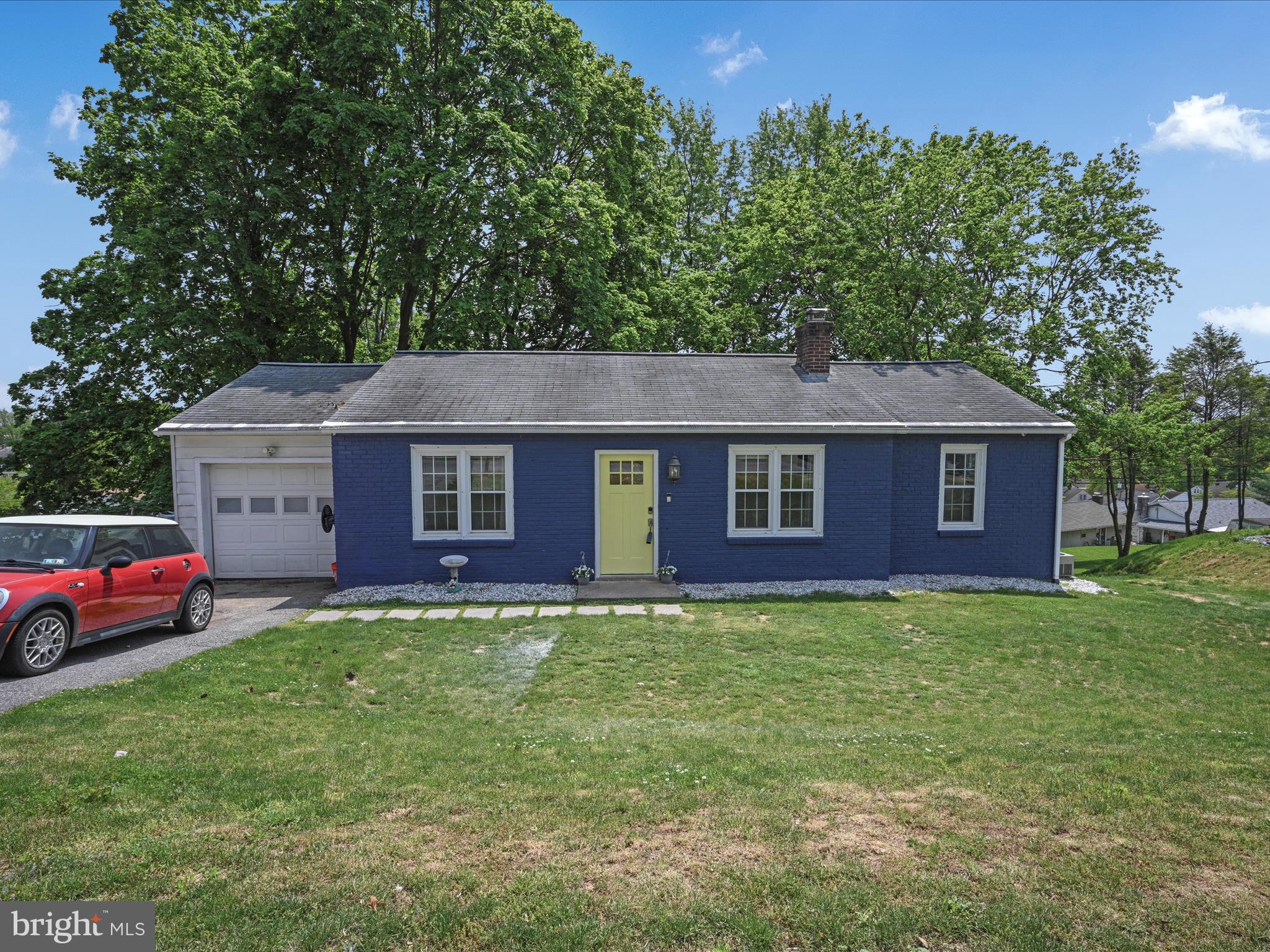 Don't let this home fool you. This home features 3-bedrooms with 2 full baths-2 bedrooms on the first level with a full bath  and 1-bedroom and 1 full bath on the lower level. There's a beautiful laundry area on the first floor which is super convenient. Enjoy dinner around the separate dining area while still able to converse with those sitting in front of the wood burning fireplace.
But wait, there's more! As you head down the winding staircase there is room for a play area/video game area or just quiet reading area. Ample storage in the closets and under the steps. You'll be thrilled when you enter the movie theatre equipped with seating for 12, a 120" screen, 17 built-in speakers, 8 ceiling, 8 surround and one center!
The cherry on top is the 2-story 14' deep x 20' wide workshop. The second story loft are is 14' deep x 12' wide! Just think of all the projects you can complete there! There is also a separate gravel parking area that is 12' wide x 40' long. Don't miss this great home! Call Today!
