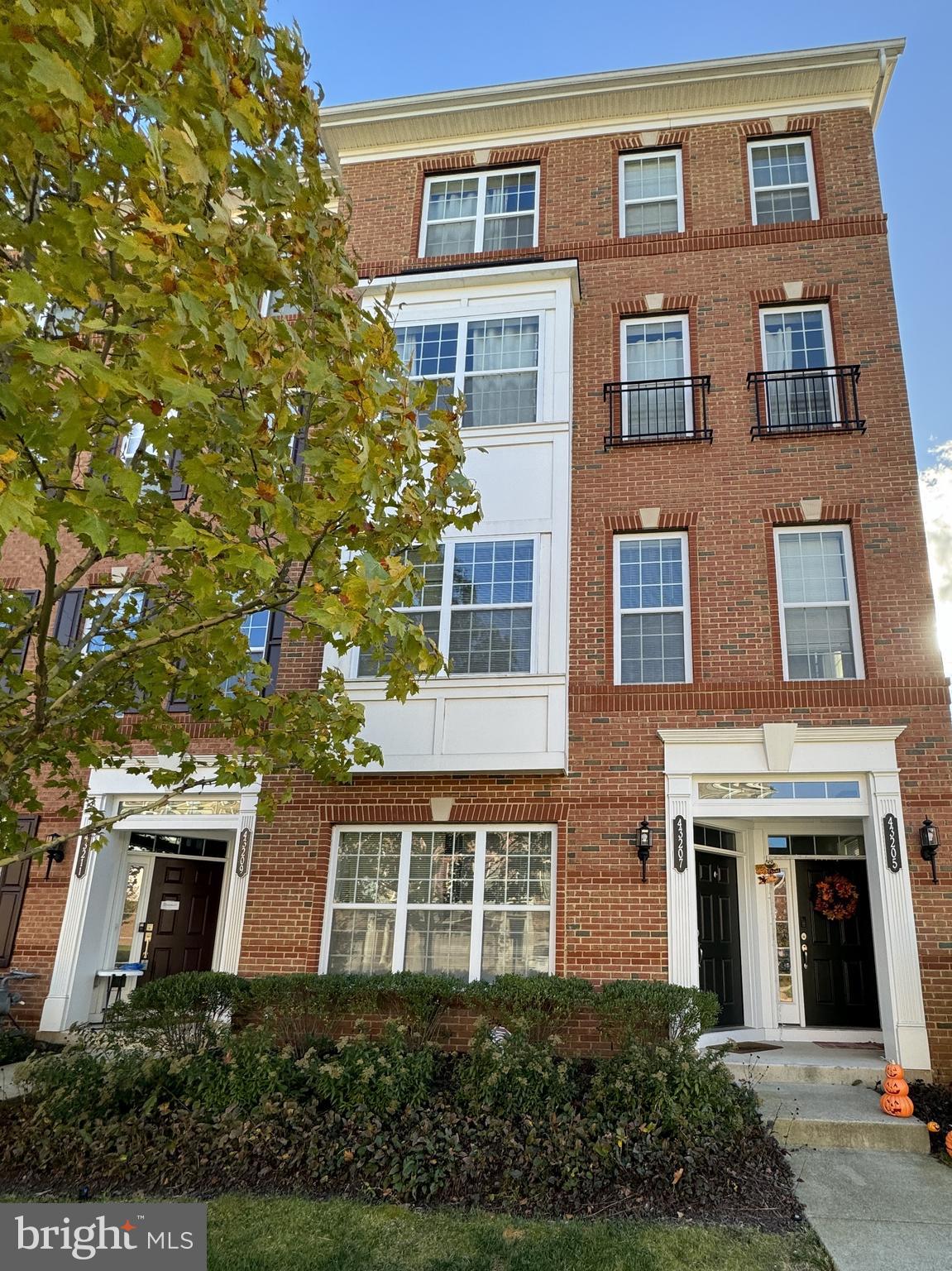 Welcome to a move-in pristine home! This end-unit is a lower level townhouse-style condo that shows like a model home. It boasts wide plank hardwood floors throughout the entire unit, neutral colors, and lots of natural light. 

The main level is an entertainer’s dream with an open concept gourmet kitchen that connects to a spacious dining room and living room. The kitchen features granite countertops, subway tile backsplash, stainless steel appliances, a gas range, lots of cabinetry, a dedicated pantry, and a generous island with bar stool seating. A half bath in the main level makes it convenient for your guests, while adding to your privacy. This unit provides a one car garage and driveway for your parking needs and lots of street parking for visitors.

Upstairs, the primary suite offers a generous walk-in closet, a spacious bedroom with tray ceilings and an ensuite retreat with a shower, double vanity, private water closet, and a deep soaking bathtub to relax after a long day. A covered balcony off the primary bedroom offers the ideal spot for morning coffee or to unwind with a book. 

Two additional bedrooms, a hall bath and a laundry room complete the second level. The community offers numerous recreation amenities including a pool, a clubhouse and a gym, as well as miles of walking trails, tot-lots and sport courts.  Tenant pays a Key Fob for access ($20). The Silver Line Metro is just 3 miles away and there is quick access to Loudoun Parkway, The Dulles Toll Road, Rt. 50 and Rt 28, offering easy commuting options. Don’t miss out!