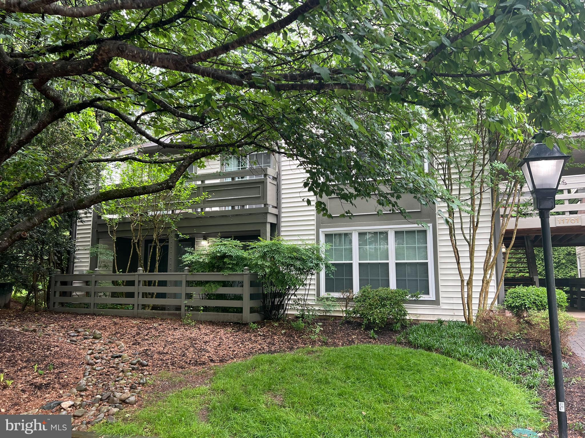 Welcome to this wonderful 2 bedroom, 2 bath, ground level condo in the heart of Reston. This building and condo is at the end of the road with no traffic passing by. As you enter the home, you notice that the floor has been upgraded and used very lightly. This home is very clean and original and awaiting your style and design ideas to transform it into the home you envision. The family room is spacious and features a fireplace and open to the kitchen and dining area. There is a door leading to a large, covered patio that is also accessible from both bedrooms. This is a wonderful place to sit and relax and enjoy the outdoors in the warmer months. There is an in-unit washer and dryer for your convenience too. The condo is pet-friendly and also conveys with 1 assigned parking spot, #99 which is steps from your front door. There is plenty of guest parking too in the community, and very close to this home. There are also tennis courts near by for your enjoyment along with pools, recreational facilities and all the Reston association has to offer. This home is also minutes from major commuting routes, 267, 66, Reston Parkway, the Reston Town Center, shopping, restaurants, grocery stores and many other conveniences. Welcome home!