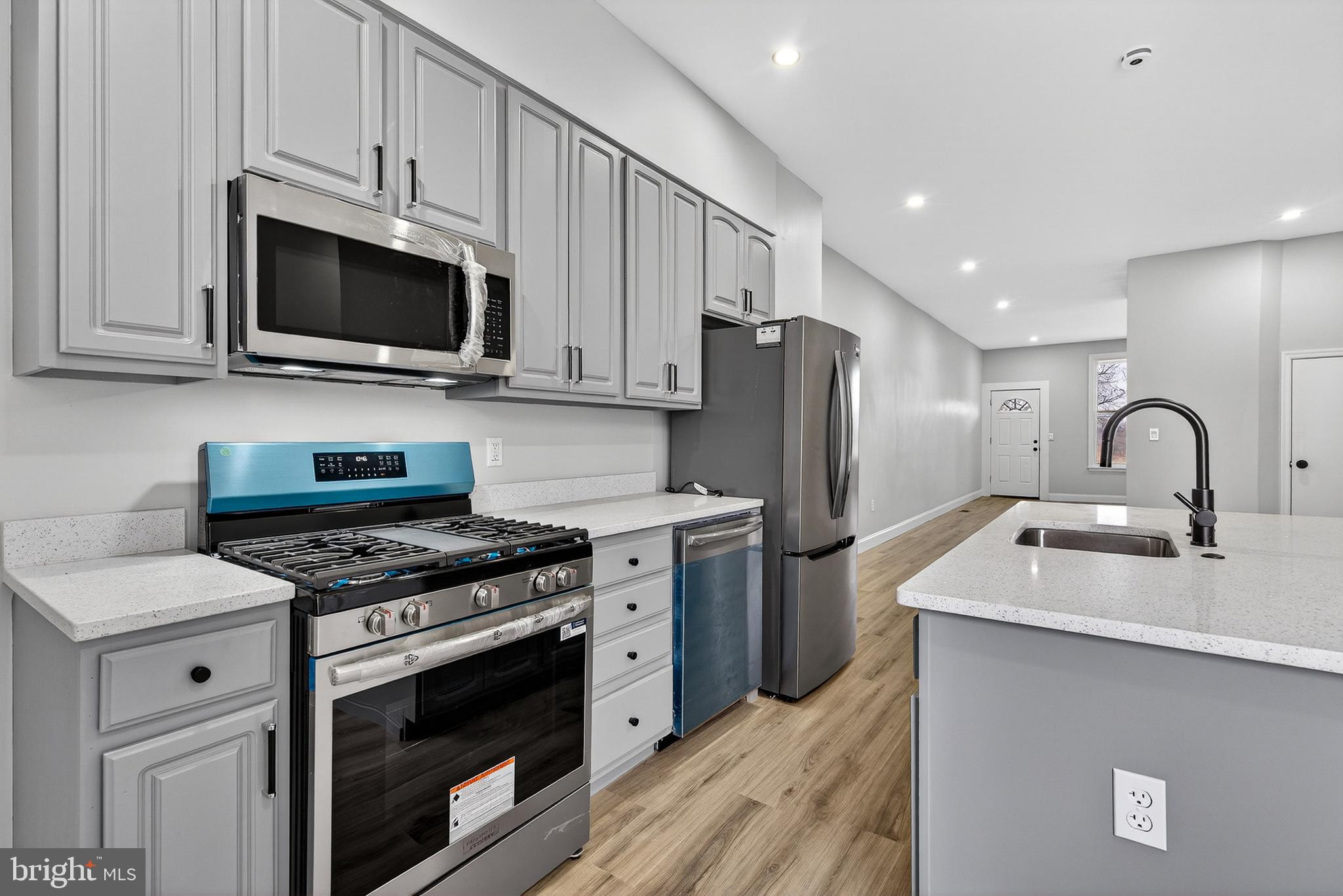 Renovated Rowhome Directly Across from Clifton Park!        
Welcome to your completely reimagined urban oasis! This stunning 3-bedroom brick rowhome has been meticulously renovated from top to bottom, blending classic Baltimore charm with sleek, high-end modern finishes. Situated directly across from the sprawling greenery of Clifton Park, this move-in-ready gem offers the perfect balance of city convenience and park-side serenity. The main level features a bright and airy floor plan with brand-new flooring and fresh, neutral paint that flows seamlessly from the living area to the kitchen. Truly the heart of the home, featuring elegant grey cabinetry, striking white countertops, and a large central island with seating—perfect for morning coffee or entertaining guests. A stylishly updated bathroom complete with custom tile work, a modern vanity, and contemporary fixtures. Three spacious bedrooms upstairs offer ample natural light and generous closet space. Unbeatable Location & AmenitiesYou are steps away from everything you need! This property boasts a "Very Walkable" score and sits in a prime "Transit-Oriented" location. Literally outside your front door is Clifton Park, home to the Clifton Park Golf Course, public tennis courts, and miles of walking trails.
Enjoy local favorites along the Harford Road corridor, including Maggie’s Farm and Taste This, or take a short drive to the vibrant shops and restaurants of Charles Village and Harbor East. Located minutes from Johns Hopkins University, Morgan State, and Baltimore City College. With "Excellent Transit" options nearby, commuting across the city or to the Inner Harbor is a breeze.Move-In Ready! With brand-new systems, updated electrical, and designer finishes, all that’s left to do is unpack. Schedule your showing today!