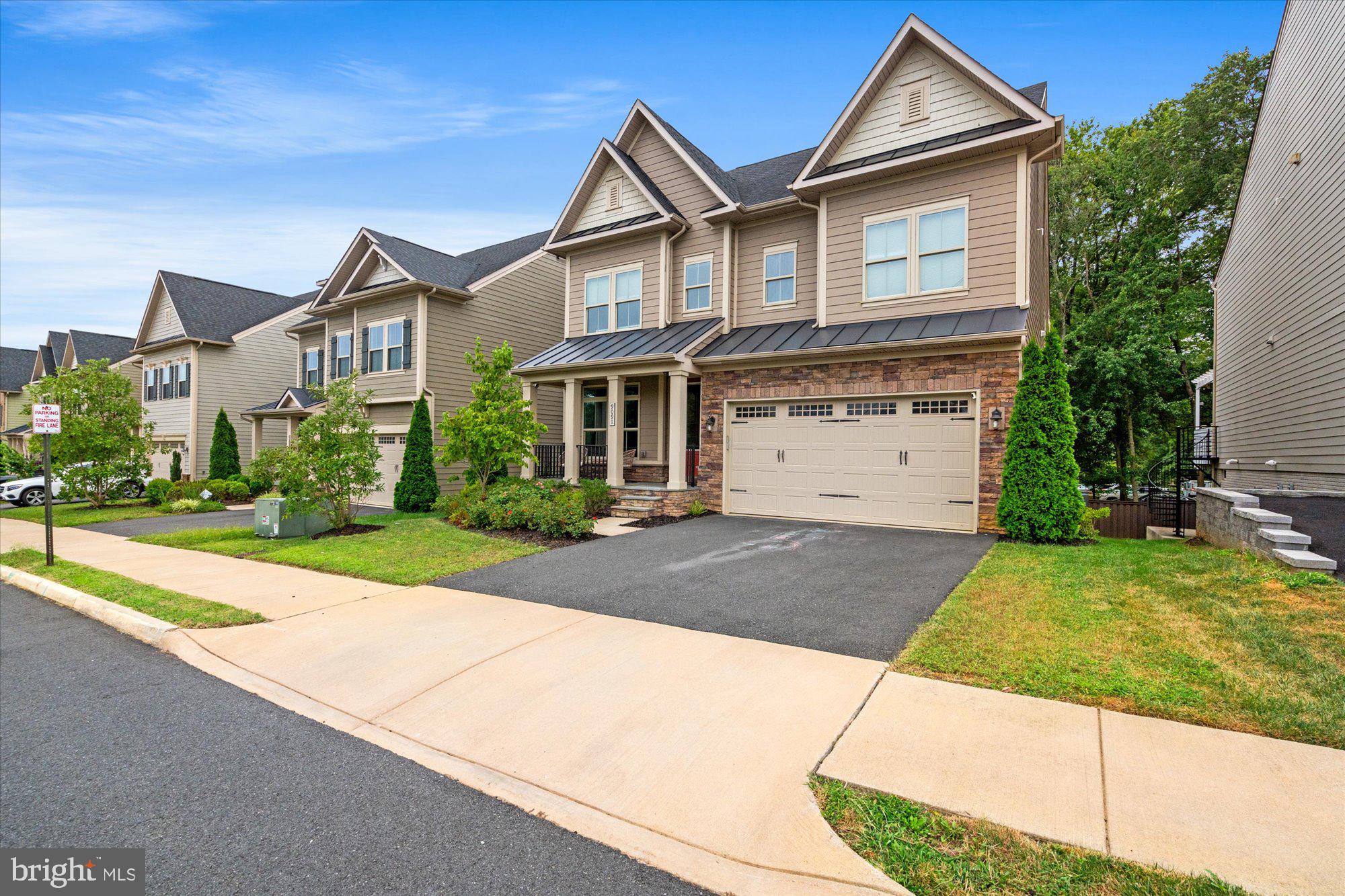 Welcome to 9091 Bear Branch Place! Built in 2017, this is one of the two largest models in the subdivision with over 5,000 sqft of light filled living space. With 5 BR & 5.5 BA (with option for 6th BR), this home offers it all. Open floor plan with high ceilings, hardwood floors throughout main level, recessed lighting & upgraded fixtures. Large gourmet eat-in kitchen with cooktop, custom range hood, upgraded Bosch dishwasher, built-in microwave & double wall-oven. Cozy family room with natural stone accent wall, built-in 5.1 surround sound speaker system & two additional, non-standard, windows for added natural light. Mudroom leads you to two car garage with Tesla charger. Trex deck with built-in custom lighting plus bistro lights; perfect for entertaining at night. Fully finished lower level walk out basement with ceiling mounted projector system, high ceilings, additional window, option for 6th BR, full bath, storage room with dedicated outlets for gym equipment & wet bar rough-ins. Spacious Primary suite with His & Her walk-in closets, two additional non-standard windows. Ample en-suite bathroom with soaking tub & walk-in shower with upgraded tile & fixtures including dual shower heads & body sprays. Generous 2nd & 3rd BR with Jack & Jill full bathroom. 4th BR with full en-suite bath. Laundry room with upgraded XL front loading washer & dryer with pedestals. Upgraded third level with rec room plus 5th BR & full bath. Located less than 2 miles to Vienna Metro Station, Mosaic District, several shopping centers, grocery stores & a plethora of restaurants. Easy access to Rt 50, I-495 & I-66.