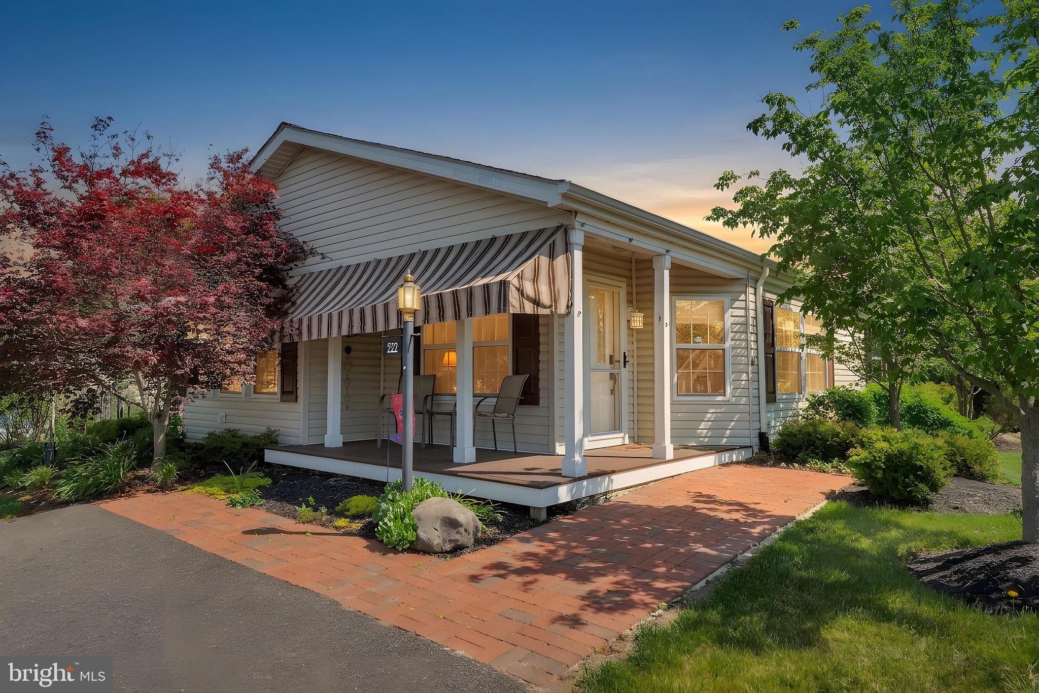 Welcome to this beautifully updated and spacious 3-Bedroom Williamsburg model in desirable 55+ Buckingham Springs! Filled with warmth, natural light, and thoughtful upgrades throughout, this move-in ready home offers the perfect blend of comfort, style, and easy living. A charming covered front porch with remote controlled retractable awning welcomes you into a bright Foyer with a large coat closet. Inside, luxury vinyl plank flooring flows throughout the main living spaces, while soaring vaulted ceilings, plantation shutters, and an open-concept layout create an airy and inviting feel. The spacious Living Room is perfect for relaxing or entertaining and the updated Kitchen features modern gray cabinetry, stainless steel appliances, a skylight, and a sunny breakfast area surrounded by windows and plantation shutters, along with beautiful built-in cabinetry for added charm and storage. The adjacent Dining Room opens seamlessly into the stunning Sunroom, a true highlight of the home, featuring exposed beams, vaulted ceiling, walls of windows, and sliding glass doors leading to two private patios overlooking peaceful gardens and beautifully landscaped outdoor spaces and storage shed. Just down the hall are two Bedrooms, a full Hall Bath with tub shower, and a bright and spacious Primary Suite complete with walk-in closet, and a sliding barn door leading to a beautifully updated Bath with walk-in shower, elegant white vanity, Bidet and towel warmer. Completing the home, an oversized Laundry Room offers abundant cabinetry and storage, along with conveniently tucked-away utilities, washer, dryer, and hot water heater. With skylights, garden views, and natural light pouring in from every angle, this lovingly maintained home is truly a special find. Ideally located near Peddler's Village, New Hope, Doylestown, and Newtown, you’ll enjoy easy access to shopping, dining, parks, and entertainment. Buckingham Springs also offers a clubhouse, pool, spa, and vibrant community lifestyle. Just move in and enjoy!