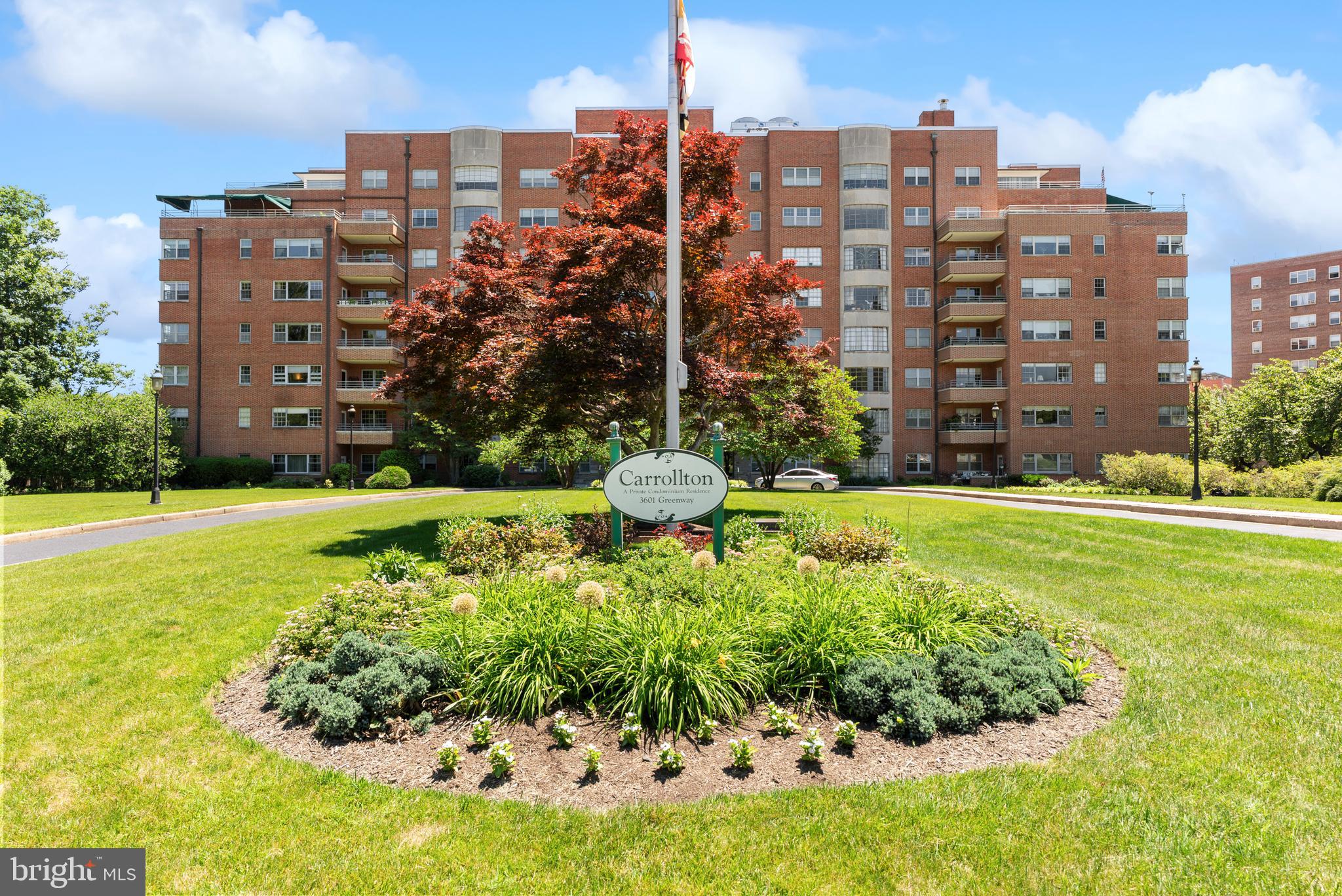 Welcome to The Carrollton, a distinguished brick landmark on Greenway in one of Baltimore City's most treasured neighborhoods. This bright and move-in ready two-bedroom, two-full-bath residence showcases the building's famed oversized windows, gorgeous parquet wood floors, and a comfortable floor plan that blends classic charm with everyday functionality. Natural light fills the living spaces, creating a warm and inviting atmosphere throughout. Residents enjoy the convenience of a full-service building offering 24-hour security, front desk attendance, garage parking, and private basement storage. This unit includes one deeded parking space! The condominium fee covers heat and air conditioning, adding exceptional value and convenience. Perfectly positioned near Johns Hopkins University, The Carrollton places you moments from major hospitals, universities, Charles Village, neighborhood restaurants, and the popular Waverly Farmers Market. Enjoy midtown condo living with rich architectural character, Art Deco influences, grand common spaces, and the timeless appeal of one of Baltimore's most recognizable residential buildings. Combining historic charm, urban convenience, and an affordable price point, this is a wonderful opportunity to make your home in The Carrollton.