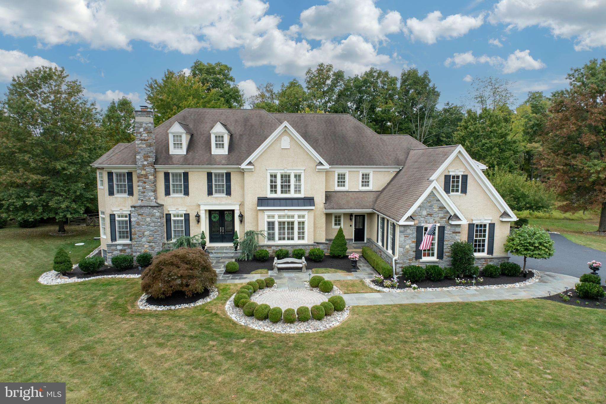 Introducing 1736 Chantilly Lane, nestled amongst the pastoral rolling hills in the idyllic neighborhood of Chantilly Farm, a premiere enclave of 34 luxurious estate homes. This exquisite CUSTOM home is set at the end of a quiet cul-de-sac, featured on a private, professionally landscaped 1 acre lot. This home will enthrall any buyer seeking an unparalleled Chester Springs location. The exceptional curbside presence sets the stage for elegance and luxury throughout, while maintaining an atmosphere of comfort and tranquility. Elegant doors welcome you into a stunning front to back foyer, with a formal living room with fireplace to your left, and a spacious dining room with a large window seat to the right. Off the living room, French doors lead you to a handsome study with a plethora of natural light. A charming butler’s pantry allows entertaining to flow seamlessly from the dining room into the kitchen. The gourmet chef’s kitchen is complete with radiant in-floor heating, custom cabinetry, custom arched doorways and a sizable walk-in pantry. This breathtaking kitchen is an entertainer's dream! Outfitted for the most discerning chef, the massive island is flanked with beautiful granite countertops. The appliances have been upgraded including new dishwasher (2019), new microwave (2020), new kitchen faucet in (2022) and new double oven (2024). The adjoining breakfast room offers ample natural light and room for an oversized dining table. Step down into the impressive family room with fireplace and gorgeous coffered ceilings, overlooking the expansive, 3 tired maintenance free deck with gazebo. This gorgeous outside retreat offers 2 retractable awnings and an under-ground irrigation system, which completes the exterior of this manicured and well lit yard. And yes, there is room for a pool! A large mudroom with custom cabinetry offers 2 entrances into the home, off the front and the garage. A second staircase is conveniently situated to take you to the upper level, where you are welcomed to the elegant and inviting primary suite, with custom plantation shutters, tray ceilings and a spacious custom walk-in closet. The sumptuous primary bath is meant for pure serenity, with a soaking tub and large shower with built-in bench and glass door. This level also boasts 4 additional oversized bedrooms, complete with en suite bathrooms and one with a Jack and Jill bath. The laundry room completes this floor with an abundance of counter space and cabinets. There is nothing left to the imagination when entering the fully finished walk-out lower level! The main area features an expansive lounge area, with custom built-in cabinetry, adjacent to another open area for games and entertaining. A separate home gym allows for an enjoyable work-out any time of the day! BUT…. the PIECE de RESISTANCE….the opulent STATE OF THE ART IN-HOME THEATER, with 12 theater grade reclining chairs, complete with ticket booth, professional pop-corn machine and concession stand, is unparalleled! You are instantly transformed to the grande old days at the theater! There is even a marquee to showcase the latest movies!  A fully equipped kitchenette with new refrigerator and large island completes this space. Built by renowned Moser Homes, this meticulously maintained home has over $400K of upgrades from previous owners. The 4 car garage with custom built-in cabinetry is complete with a PET WASHING STATION. FULL HOUSE GENERATOR, California plantation shutters throughout, new septic (2016), two new HVACS (2018), the list goes on and on-this home has it all. Situated in the award winning Downingtown EAST SD, and acclaimed STEM Academy, as well as neighboring Montgomery School. Minutes from all major roads, including PA Turnpike, Rt 30 and  Rt 202 for easy commuting. Convenient to wonderful restaurants, markets and retail shopping nearby. Don't miss this opportunity to experience living in the highly desirable and much sought after Chantilly Farm!