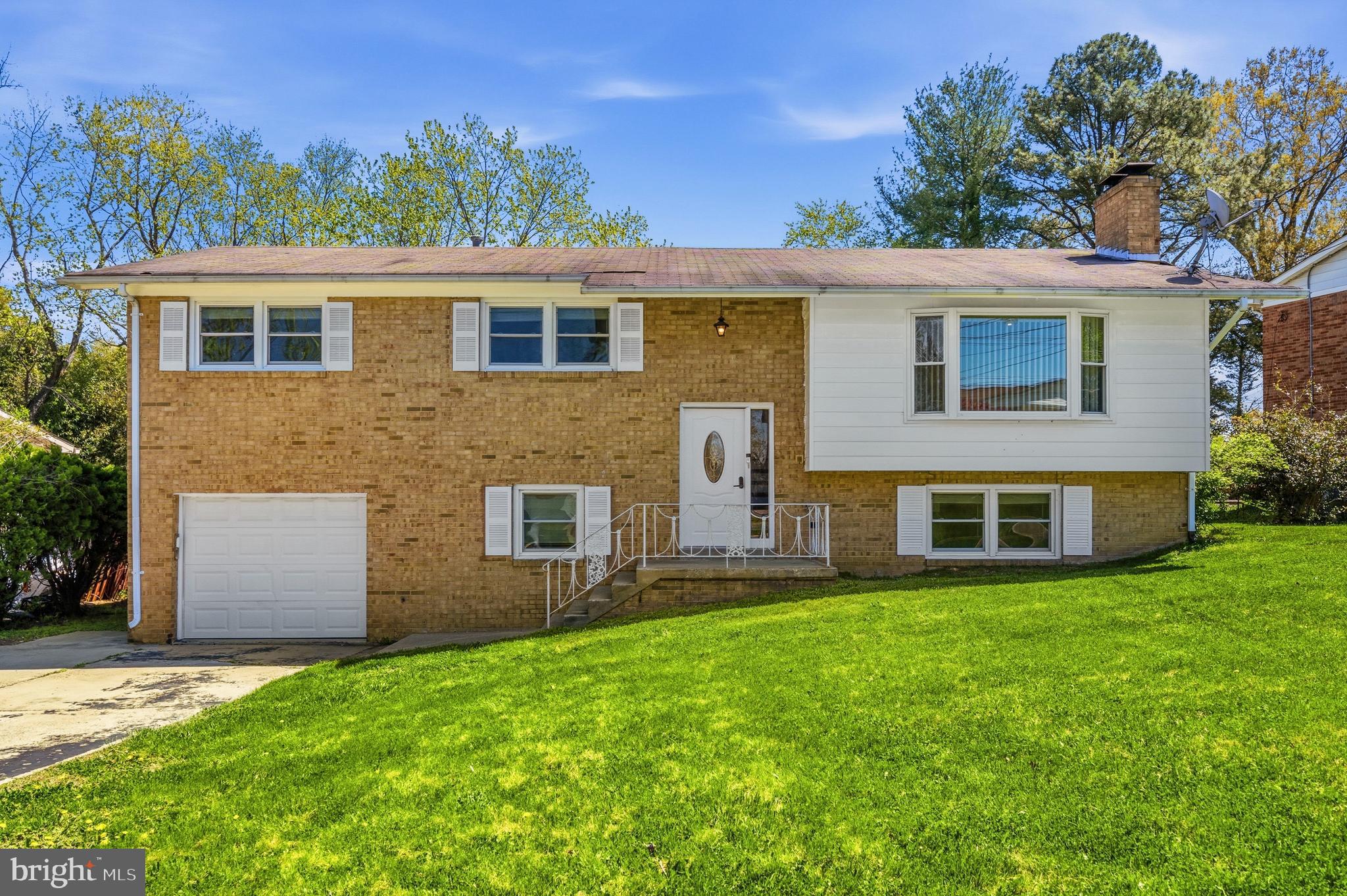 Welcome to this spacious and thoughtfully updated home offering flexible living across 2 finished levels. The inviting family room features a wood-burning fireplace and a large window that fills the space with natural light. The kitchen is designed for both everyday living and entertaining, with granite countertops, breakfast bar seating, recessed lighting, a striking light fixture over the island, and warm wood cabinetry. Durable LVP flooring runs throughout the entire home, complemented by recessed lighting throughout.

Upstairs, you’ll find three spacious bedrooms, including a primary suite with an attached bathroom. The fully finished lower level adds significant living space, complete with a bedroom, full bathroom, and a finished laundry room. This level also features an exposed brick wood-burning fireplace, recessed lighting, and ample room for entertaining, plus a walkout to the backyard and patio.

Outside, enjoy a fenced backyard with a cement patio and flat yard offering plenty of space for outdoor activities. Conveniently located with easy access to Washington, DC, the Green Line Metro, I-495/Beltway, Joint Base Andrews, and National Harbor, this home combines comfort, space, and accessibility.