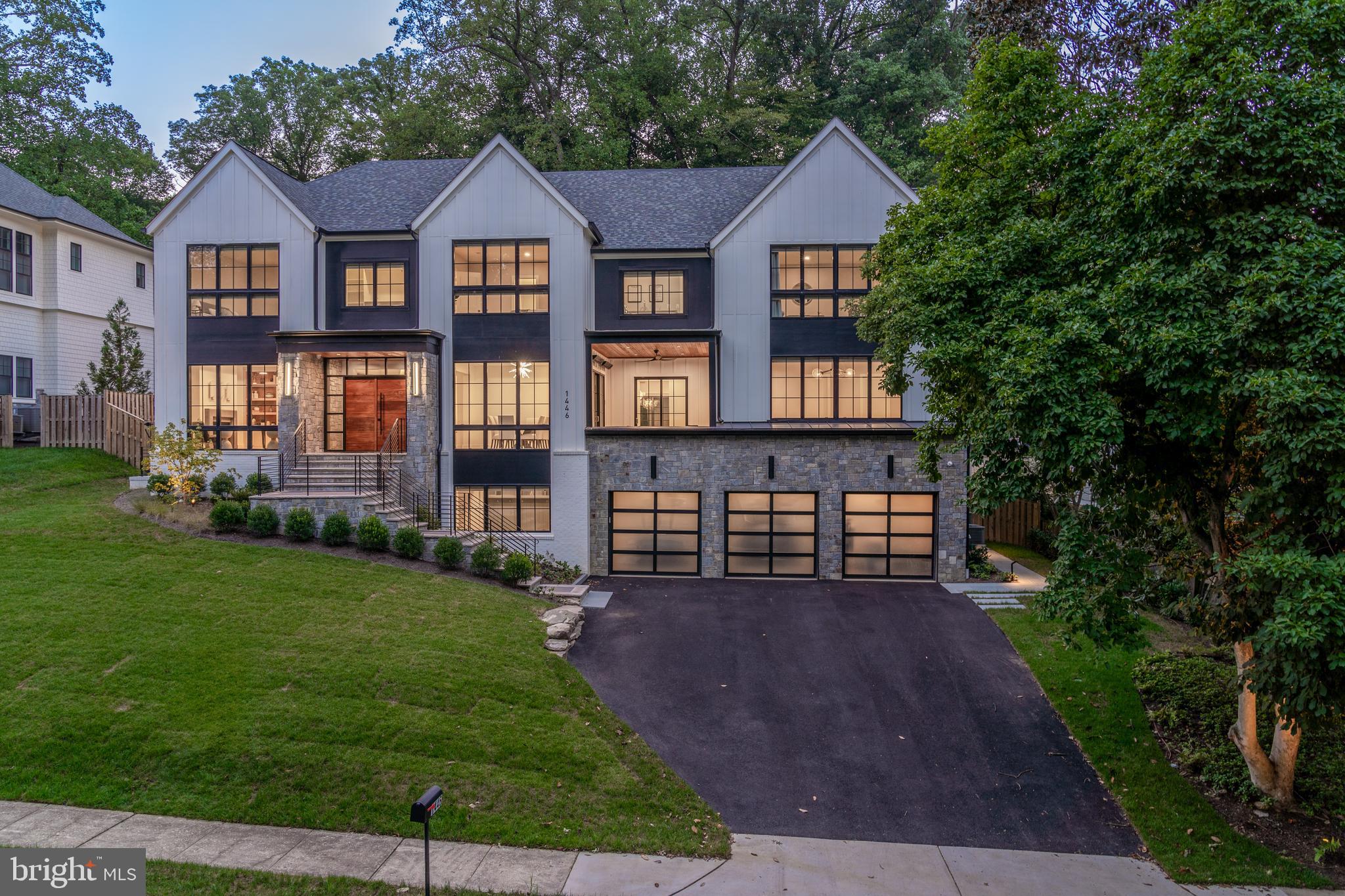 Welcome to 1446 Woodacre Dr, an exquisite home nestled in the prestigious Chesterbrook Woods neighborhood of McLean, VA. This stunning 2022 creation by Morbil Custom Homes seamlessly blends traditional elegance with sleek contemporary flair, offering an unparalleled living experience in one of Northern Virginia's most desirable areas.

Boasting over 8,200 square feet of luxurious living space across three meticulously designed levels, this transitional-style masterpiece is situated on a sprawling 17,696-square-foot lot, providing the perfect balance of privacy and community. The home features 6 spacious bedrooms, 6 full bathrooms, and 2 half bathrooms, all thoughtfully crafted with exceptional attention to detail.

As you step inside, you'll be captivated by the tall ceilings and the seamless flow of indoor and outdoor living spaces. The custom mahogany front door with glass sides sets the tone for the elegance that awaits within. The main and upper levels feature stunning 10¼” White Oak engineered flooring. The heart of the home is the custom-designed kitchen, equipped with Miele appliances, a tall wine fridge, a built-in refrigerator and freezer, two dishwashers, quartz countertops, a full backsplash, and a large island. Two walk-in pantries offer ample storage for all your culinary needs. The main level also features a two-story family room with a two-sided fireplace, a study, a dining room, a custom-designed butler’s pantry, a large in-law suite, a powder room, a front porch, and a screened-in back porch.

Ascending the wide staircase to the upper level, you’ll be greeted by a breathtaking hallway with exquisite wall paneling and light fixtures. The upper level includes 4 bedrooms, a lounge area, and a laundry room. The primary suite is a true retreat, featuring cathedral ceilings with beams, a gas fireplace, a sitting area, a wet bar, and two generous walk-in closets. The spa-like bathroom is a sanctuary, complete with a steam shower, heated floors, and dual vanities.

The lower level is designed for unwinding and entertaining in style. It features a large rec room with a fireplace, a wet bar, and access to the backyard via walk-up stairs. The lower level also includes a fully equipped exercise room, a bedroom, a full bathroom, a half bathroom, and the utility room.

This home’s five fireplaces provide warmth and ambiance across all the levels-study, great room, rear porch, family lounge, and the second-floor owner’s suite. Additional amenities include a three-car garage with Clopay Avante frosted glass doors, a state-of-the-art music system, custom draperies and blinds, a Culligan water softener, irrigation system, fully fenced backyard, professionally landscaped front and back yard and a security system.

Outdoors, the professionally designed and landscaped grounds by Joseph Richardson feature a heated screened porch, an irrigation system, landscape lighting, an outdoor kitchen area, and a luxurious outdoor jacuzzi. Lush landscaping enhances the beauty and tranquility of this outdoor oasis.

Chesterbrook Woods is served by highly regarded public schools in the Fairfax County Public Schools system, including Chesterbrook Elementary School, Longfellow Middle School, and McLean High School. McLean, VA, is one of the most desirable areas in Northern Virginia, offering a perfect blend of suburban tranquility and urban convenience. Located just minutes from Washington, D.C., McLean is known for its top-rated schools, luxury homes, and a strong sense of community. 

Living at 1446 Woodacre Dr means you're only about 20 minutes from Dulles International Airport and Reagan National Airport, making travel easy. You'll find world-class shopping and dining at Tysons Corner just 10 minutes away, while the cultural attractions of the Kennedy Center are a mere 15-minute drive. Crystal City, with its thriving business and tech hubs, is about 20 minutes away. This location offers unparalleled access to everything