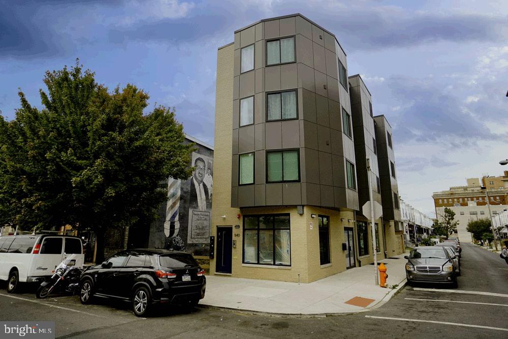 FULL 10 Year Tax Abatement. Incredible Opportunity! Residential units 100% occupied.  Corner Quadplex with Commercial first floor on busy 52nd street corridor. (Condominium ready) Excellent for AIRBNB Rentals! (CMX2 Zoning) Almost 5000 sq ft. Seller Rate Buy-down offered. The first floor commercial space is a raw bi-level space 1640 Sq ft and ready for a new business on this thriving commercial corridor. Above are 3 identical apartments. Each Apartment is a 2 Bedroom, 2 Bathroom unit with designer finishes and high-end stainless steel appliances. Quartz Countertops. Extremely well laid out with a bedroom on either side (one Ensuite) of the unit and the living/kitchen space in the center. Full of natural sunlight with Bay windows along the entire side of the building. One of the bedrooms has a private bathroom. All utilities are separate including water. All units are Electric. Each unit can be sold separately as condominiums in the future to maximize resale value. Excellent location close to the Park, Baltimore Avenue and the Market Frankford line. This is one of 8 New Construction buildings located in West Philadelphia near University City.