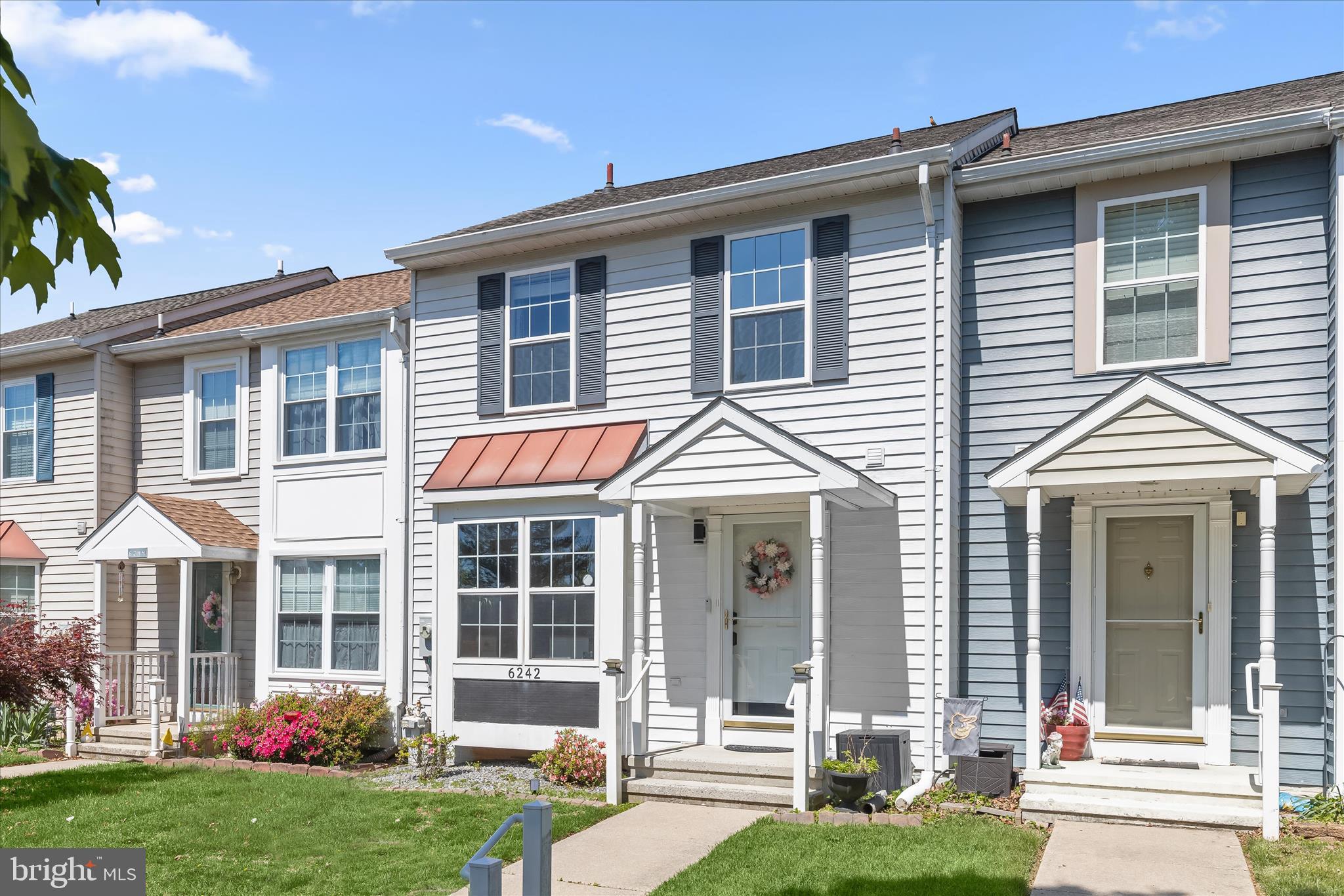 Backing to trees and offering a peaceful setting with a highly convenient location, this three-level townhome in Piney Ridge Village showcases thoughtful updates throughout, two private outdoor living spaces, and a well-designed layout that balances function and comfort.
The main level centers around an updated kitchen featuring white cabinetry enhanced with roll-out shelving and a lazy Susan, granite countertops, and recently replaced stainless steel appliances including a gas range and built-in refrigerator. A charming window seat with storage adds both character and practicality, while a pass-through window keeps the kitchen connected to the open concept living and dining areas. From the living room, step outside to a deck overlooking trees, complete with a retractable awning for added comfort. A half bath completes this level.
Upstairs, three bedrooms and a full bath provide comfortable accommodations. The primary bedroom includes a double closet, and the updated full bath features distinctive touches such as an arched ceiling detail separating the recently replaced shower from the vanity area, along with a convenient linen closet.
The lower level offers a spacious family room with a wall of closets spanning the width of the space, providing exceptional storage. A sliding glass door leads to a lower deck and a sizable backyard, one of the few in the community with direct walkout access and a wooded backdrop. This level also includes a full bath and a utility room with laundry and a gas dryer.
Additional highlights include beautiful landscaping, two reserved parking spaces with ample visitor parking, and a Ring alarm system with sensors on doors, windows, and smoke detectors. A radon mitigation system is already installed for added peace of mind. Since 2020, updates include a whole house water filter, shower, kitchen appliances, water heater, and washer and dryer.
This home benefits from easy access to everyday essentials. Grocery stores, shopping, and local restaurants are just minutes away, along with gyms and recreation facilities supporting a variety of fitness routines. Nearby schools serve the area, and parks, trails, and community spaces enhance the outdoor lifestyle. The community also maintains common areas, handles snow removal, and features a playground, rounding out a setting that balances convenience with a strong sense of community.