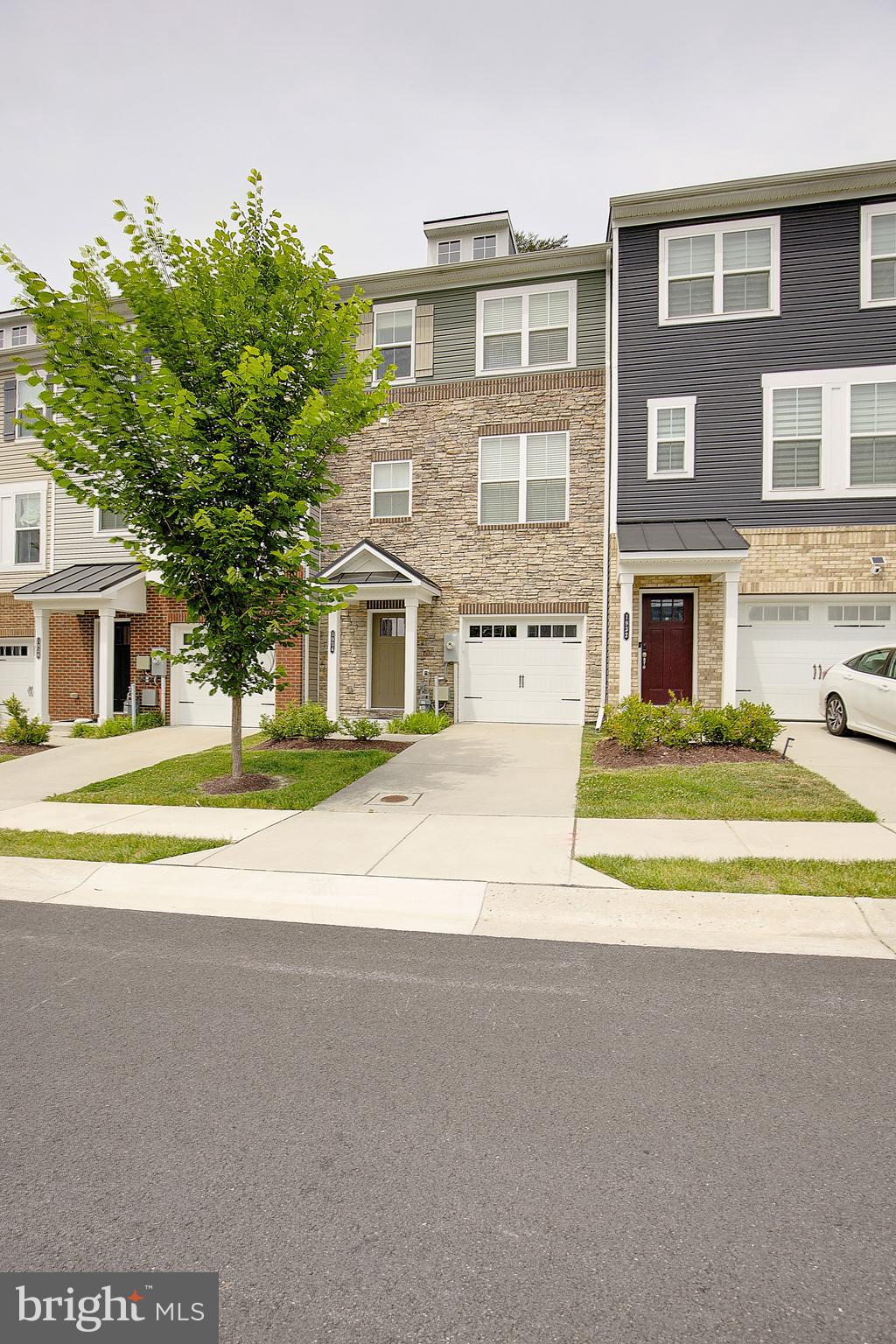 Welcome to  a rare opportunity to own one of the most privately situated homes in The Ridge (1934 Red Jasper Rd Hanover, Maryland). Nestled in a premier interior location, this exceptional townhome offers peaceful community views and a sense of tranquility that can be enjoyed from all three levels.
Designed for both everyday comfort and effortless entertaining, the thoughtfully crafted floor plan is enhanced by abundant natural light and premium upgrades throughout. A professionally customized California Closets® system delivers exceptional organization and storage, adding both elegance and functionality to the home's living spaces.
Ideally located in the heart of Hanover, this home combines a serene residential setting with unparalleled convenience to Fort Meade, NSA, BWI Airport, Arundel Mills, Maryland Live! Casino, and major commuter routes to Baltimore, Washington, D.C., and Annapolis.
Offering the perfect balance of privacy, modern comfort, and accessibility, this move-in-ready home is an exceptional opportunity in one of Hanover's most sought-after communities.
Home Highlights:
• Walkout Entry Level: A spacious, fully finished flex room with 9-ft ceilings serves as a versatile family room, home office, gym, or guest suite. It includes a half bath, custom storage, and direct access to the attached 1-car garage.
• Open-Concept Main Level: Gleaming luxury vinyl plank floors, 9-ft ceilings, and crown molding set the stage for daily living and entertaining.
• Gourmet Kitchen: The centerpiece of the home features upgraded cabinetry, granite countertops, a custom tile backsplash, a gas stove, pantry, and a large, oversized island with bar seating.
• Luxurious Primary Suite: Enjoy peaceful wooded views, a stylish barn door, a customized walk-in closet, and a spa-like en-suite bath featuring double vanities and an upgraded tile shower.
• Convenient Upper Floor: Includes two additional bedrooms with a customized reach-in closet system., a full hall bath, and a dedicated laundry area with a high-end washer and dryer.
Location Overview
Hanover sits between Baltimore, Washington, D.C., and Annapolis, making it one of the most commuter-friendly areas in central Maryland. The Ridge is located near Red Jasper Road and Ridge Trail Circle, with quick connections to:
• Fort Meade – approximately 10 minutes away
• Baltimore/Washington International Thurgood Marshall Airport (BWI) for domestic and international travel.
• Major highways including I-95, MD-100, and MD-295 (Baltimore–Washington Parkway)
• The MARC commuter rail system for travel to Baltimore and Washington, D.C.
Shopping, Dining & Entertainment
Residents are minutes from some of the region's largest retail and entertainment destinations, including:
• Arundel Mills shopping mall.
• Maryland Live! (The casino connected to the shopping mall).
• Grocery options such as Aldi, Trader Joe's, Costco, Target, and Wegmans nearby.