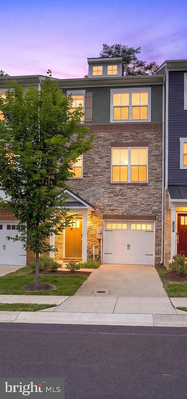 Welcome to  a rare opportunity to own one of the most privately situated homes in The Ridge (1934 Red Jasper Rd Hanover, Maryland). Nestled in a premier interior location, this exceptional townhome offers peaceful community views and a sense of tranquility that can be enjoyed from all three levels.
Designed for both everyday comfort and effortless entertaining, the thoughtfully crafted floor plan is enhanced by abundant natural light and premium upgrades throughout. A professionally customized California Closets® system delivers exceptional organization and storage, adding both elegance and functionality to the home's living spaces.
Ideally located in the heart of Hanover, this home combines a serene residential setting with unparalleled convenience to Fort Meade, NSA, BWI Airport, Arundel Mills, Maryland Live! Casino, and major commuter routes to Baltimore, Washington, D.C., and Annapolis.
Offering the perfect balance of privacy, modern comfort, and accessibility, this move-in-ready home is an exceptional opportunity in one of Hanover's most sought-after communities.
Home Highlights:
• Walkout Entry Level: A spacious, fully finished flex room with 9-ft ceilings serves as a versatile family room, home office, gym, or guest suite. It includes a half bath, custom storage, and direct access to the attached 1-car garage.
• Open-Concept Main Level: Gleaming luxury vinyl plank floors, 9-ft ceilings, and crown molding set the stage for daily living and entertaining.
• Gourmet Kitchen: The centerpiece of the home features upgraded cabinetry, granite countertops, a custom tile backsplash, a gas stove, pantry, and a large, oversized island with bar seating.
• Luxurious Primary Suite: Enjoy peaceful wooded views, a stylish barn door, a customized walk-in closet, and a spa-like en-suite bath featuring double vanities and an upgraded tile shower.
• Convenient Upper Floor: Includes two additional bedrooms with a customized reach-in closet system., a full hall bath, and a dedicated laundry area with a high-end washer and dryer.
Location Overview
Hanover sits between Baltimore, Washington, D.C., and Annapolis, making it one of the most commuter-friendly areas in central Maryland. The Ridge is located near Red Jasper Road and Ridge Trail Circle, with quick connections to:
• Fort Meade – approximately 10 minutes away
• Baltimore/Washington International Thurgood Marshall Airport (BWI) for domestic and international travel.
• Major highways including I-95, MD-100, and MD-295 (Baltimore–Washington Parkway)
• The MARC commuter rail system for travel to Baltimore and Washington, D.C.
Shopping, Dining & Entertainment
Residents are minutes from some of the region's largest retail and entertainment destinations, including:
• Arundel Mills shopping mall.
• Maryland Live! (The casino connected to the shopping mall).
• Grocery options such as Aldi, Trader Joe's, Costco, Target, and Wegmans nearby.