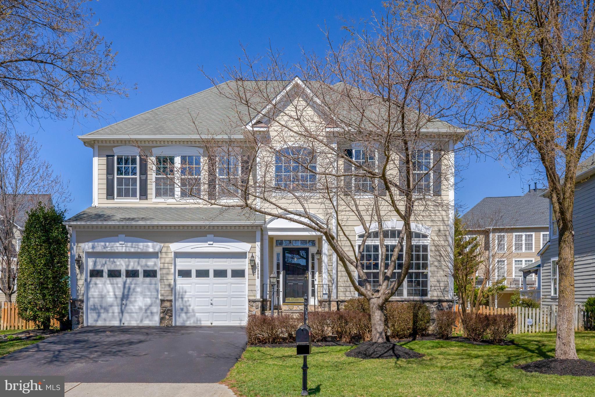 An extraordinary opportunity awaits in the highly sought-after Broadlands South community. This meticulously maintained and renovated colonial w/ two-car garage seamlessly blends timeless elegance with modern luxury across three beautifully finished levels. 

From the moment you step inside, you're greeted by a soaring two-story foyer and modern open design.  New flooring (refinished hardwoods and carpet throughout the home) create a warm and inviting ambiance, while the formal living room, with its statement windows and natural light, offers a sophisticated space for refined gatherings.

The dedicated dining room w/ gorgeous architectural details (crown molding, chair rail, fluted columns) and expansive living room provide effortless flow, leading to the stunning gourmet upgraded kitchen, a true showstopper featuring a large island, stainless-steel appliances, sleek leathered granite countertops, and abundant and stylish cabinets - a chef and entertainer's dream space. A wall of windows, 10-ft ceilings, recessed lighting, and French patio doors flood the large main family room with natural light. Designed for both comfort and style, this space also boasts upgraded gas fireplace insert, and integrated surround sound, making it the ultimate setting for entertaining or unwinding.

The main level is complemented by a large home office and a convenient half bath, catering to modern lifestyle needs.

Ascend the stylish staircase to the upper level, where the massive and luxurious primary suite awaits—a true retreat featuring  tray ceilings, custom shelving, spacious walk-in closets, and a luxury en-suite bath with a soaking tub, dual vanities, and a premium glass-enclosed steam shower with ambient lighting. Three additional generously sized bedrooms offer ample space and comfort, serviced by two fashionable full bathrooms. A convenient upper-level laundry room ensures effortless living.

The finished, walk-out lower level is designed for versatility and entertainment, featuring large recreation and game rooms, perfect for gatherings, movie nights, or gamedays. A newly finished bonus room with rough-in for an additional bathroom extend the living space, while a fitness room, custom wine cellar and spacious utility/storage area put the finishing touches on this remarkable lower level, which also includes fresh paint and carpet. 

Step outside to the beautifully landscaped backyard, where the patio with built-in kitchen (w/gas line to grill) provides a private oasis for outdoor dining, relaxation, or hosting gatherings. The fenced yard with irrigation system offers privacy, while mature trees and pristine, flat lawn create a serene setting.

Nestled in the heart of Broadlands South, this handsome home with hardiplank and stone facade enjoys unparalleled convenience, with easy access to schools (two blocks from Mill Run ES), parks, walking trails, shopping, dining, and major commuter routes, including the nearby Ashburn metro station and Dulles Airport. The Broadlands South amenities includes pools, playgrounds, tennis courts, fitness center and much more. 

A rare combination of spacious elegance, modern updates, curb appeal, and prime location—this is a home you don’t want to miss!