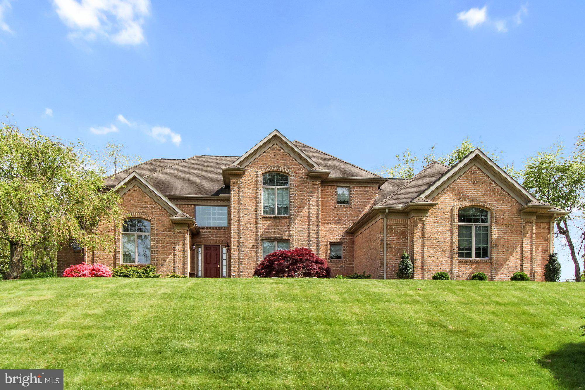 Located off the beaten path, in a well established neighborhood, is this exquisite property in Country Manor Estates.  One owner home is well cared for and ready for immediate occupancy.  Over 3,300 SF of living space and 5 car garage, on .98 acres, and backs up to horse farm.  What more could you ask for?  How about a first floor deluxe owner suite with a 6x15 walk-in closet, a 14x14 bathroom with a large, ceramic tiled, walk-in shower with corner seats, plus a large soaking tub, double sinks and ceramic tile floors.  Working from home?  You will love the first floor office with floor to ceiling bookshelves, vaulted ceiling and bright window overlooking the front lawn.  Entertaining is easy with the open floor plan and the 2 story great room that flows into the spacious kitchen with large island - corian counters, wall oven, pantry, lighting above and below the cabinets.  Off the Kitchen is the 4 season room (sunroom with heat and CAC), which leads to both patios (one with awning) and lovely landscaped yard.  The second level of this home features three spacious bedrooms, two which share the Jack-n-Jill bath, and a teenager suite/guest suite.  All bathrooms have ceramic tile floors.  All bedrooms have double closets or walk-in closets.  If you need more room, you can expand in the lower level for additional 2100 SF of living space.  Other features include a whole house stereo, central vac system, separate electric and alarm system to the detached garage, 2 story foyer, first floor laundry room, formal dining room, tankless water heater just for the kitchen sink,  the gas fireplace has a full brick chimney and could be converted to wood.  This spacious home deserves an in-person showing to appreciate all it has to offer.