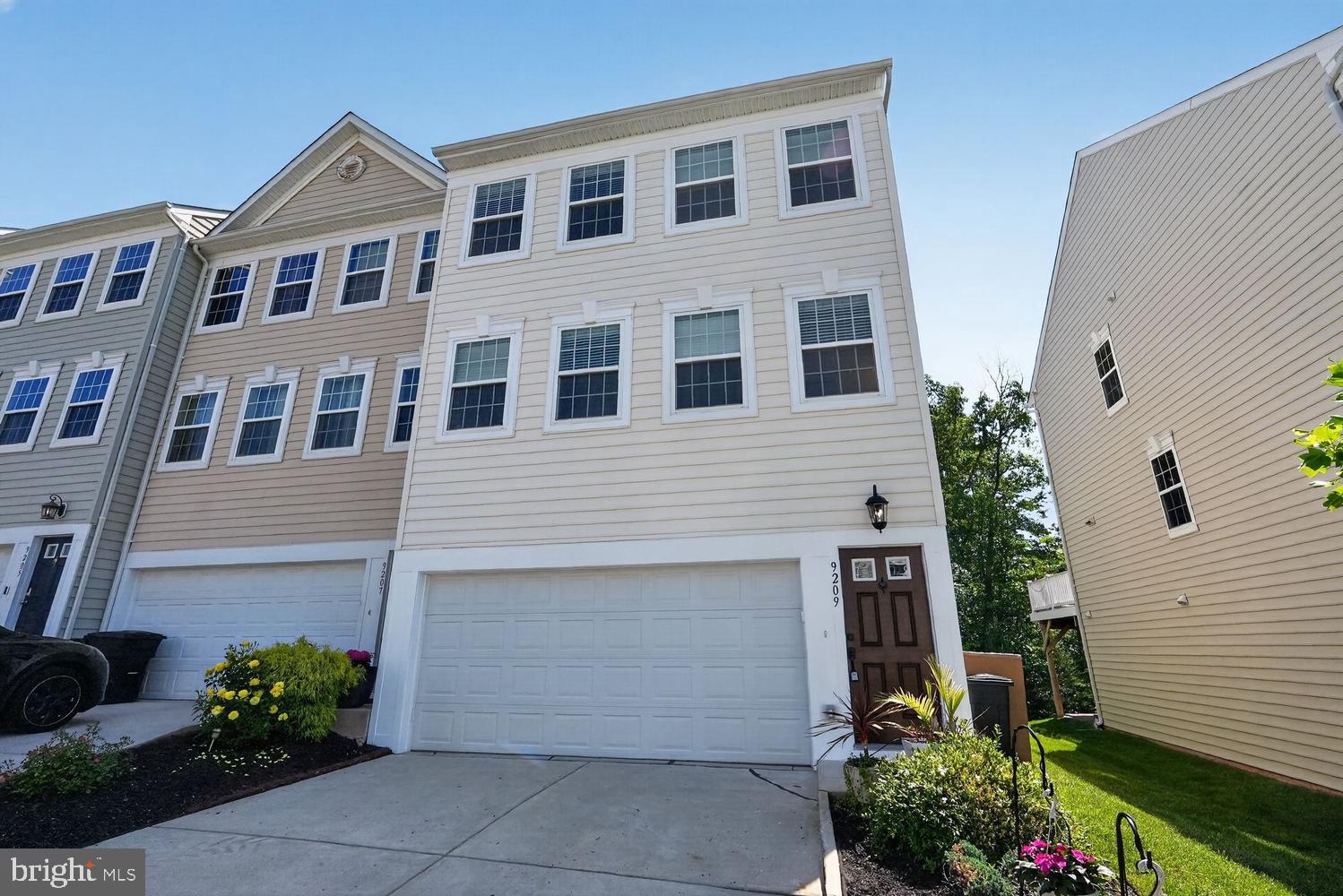 Beautifully maintained end-unit townhome in sought-after Howard County, backing to a serene wooded conservation area for added privacy and peaceful views. Built in 2015 and located in the desirable Park Overlook community, this spacious 3-level home offers 4 bedrooms, 3.5 baths, and a full 2-car garage.
The bright and open main level features a spacious living room, dining area, powder room, and an upgraded kitchen designed for both everyday living and entertaining. The kitchen boasts granite countertops, wood cabinetry, stainless steel appliances, pantry, electric range, and a large center island with breakfast bar seating. An additional flexible space off the kitchen is perfect for an eat-in dining area, home office, or cozy sitting room. Step outside through the sliding glass doors to the private deck overlooking the wooded conservation area. Both the deck and front yard feature an automated drip irrigation system for plant beds.
Upstairs, the third level includes the luxurious primary suite, two additional bedrooms, a full hall bath, and conveniently located laundry. The spacious primary bedroom showcases vaulted ceilings, a large walk-in closet with upgraded shelving, and an ensuite bath with dual vanities and dual showers.
The fully finished walkout lower level offers exceptional versatility with a 4th bedroom and full ensuite bath — ideal for guests, an in-law suite, family room, or recreation space. Walk out to the private paver patio and enjoy tranquil wooded views. The oversized 2-car garage includes insulated garage doors designed to help maintain comfortable temperatures year-round.
Move-in ready and freshly painted, this home also features hardwood floors and custom window blinds throughout.
Residents of Park Overlook enjoy convenient access to the North Laurel Community Center, offering outstanding amenities including a pool, basketball and tennis courts, playgrounds, skate park, gymnasium, walking/jogging trails, pavilions, and more. Ideally situated between Baltimore and Washington, DC, and just minutes from historic Laurel, Savage Mill, Fort Meade, Laurel Town Center, shopping, dining, grocery stores, and major commuter routes including I-95, I-295, MD-32, and US-29. Located within the highly rated Howard County Public School System. ***Some photos are virtually staged***