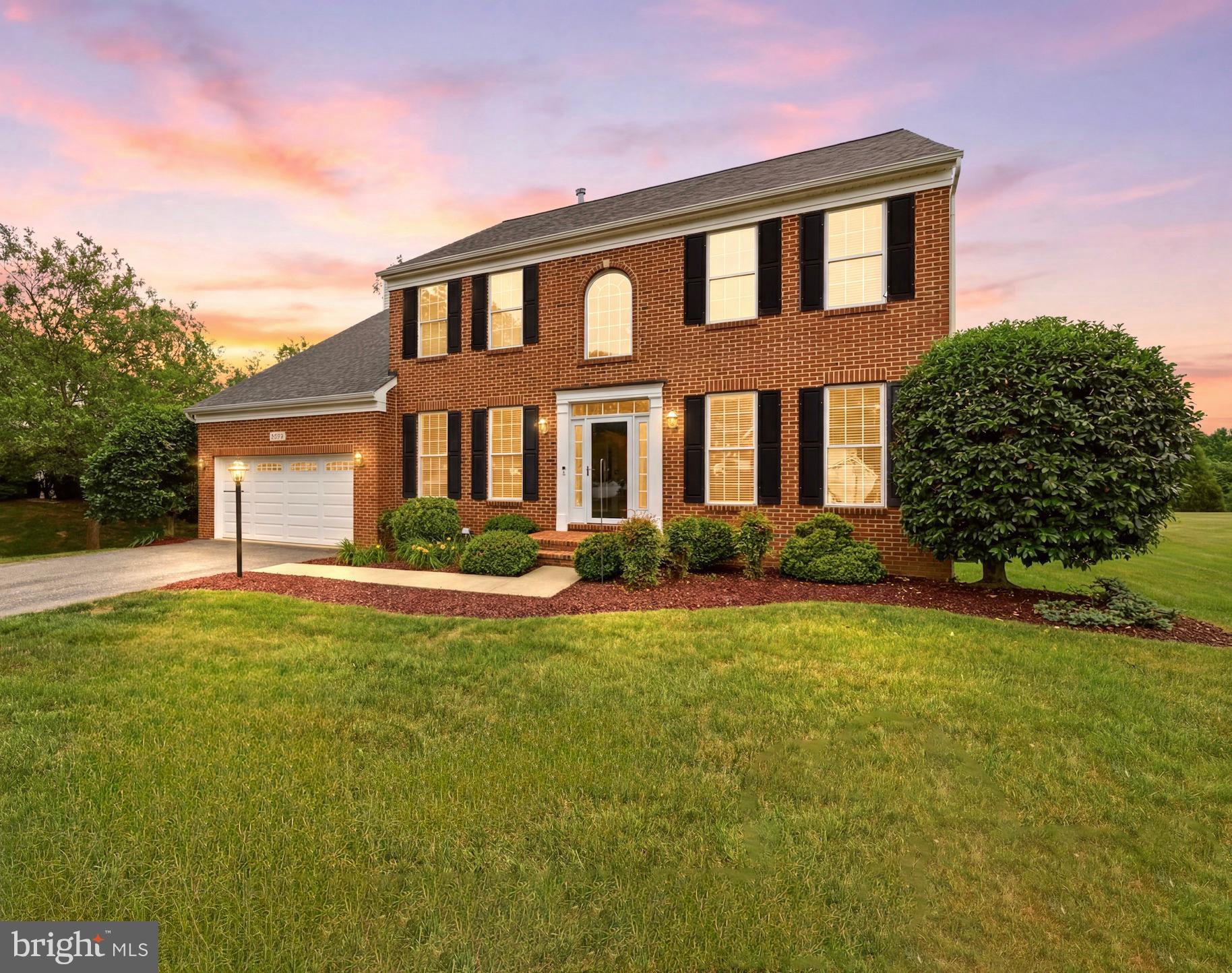 Welcome to this exceptional brick-front Winchester Homes colonial, offering over 4,400 square feet of beautifully finished living space on more than half an acre. A dramatic two-story foyer with a sweeping curved staircase creates an unforgettable first impression and sets the stage for the elegance and thoughtful design found throughout.

Designed for both comfortable everyday living and effortless entertaining, the main level features 9-foot ceilings, a private home office with custom built-ins, and an inviting open-concept floor plan. The gourmet kitchen serves as the heart of the home, showcasing an expanded center island, 42-inch cabinetry, double wall ovens, upgraded countertops, stylish backsplash, and abundant workspace. The kitchen opens seamlessly to the sun-filled family room, where a cozy gas fireplace creates the perfect gathering space.

Upstairs, you'll find three generously sized secondary bedrooms along with a luxurious primary suite that serves as a private retreat, offering ample space to relax and recharge. The fully finished walk-up lower level provides exceptional flexibility with a spacious recreation room, full bath, and potential fifth bedroom, making it ideal for guests, multi-generational living, a home gym, or additional office space.

Outdoor living is equally impressive. Enjoy morning coffee or evening gatherings on the low-maintenance composite deck or unwind in the expansive screened porch overlooking the private backyard and peaceful views. Additional features include an oversized two-car garage and a substantial unfinished storage area in the basement  offering room for future expansion or organization.

Ideally located near shopping, dining, and everyday conveniences, this home offers easy access to Routes 198, 29, 200 (ICC), and I-95, making commuting to both Washington, D.C. and Baltimore a breeze.

This home has been well cared for by the original owners. Recent improvements include a 35-year architectural roof (2020), AC condenser (2019), tankless water heater with 10-gallon reserve tank (2019), insulated garage doors (2015), upgraded kitchen countertops, backsplash, and expanded island (2021), luxury vinyl plank flooring in the lower level (2026), and a new stair runner (2026). For added peace of mind, a one-year home warranty conveys with the sale. Welcome Home!