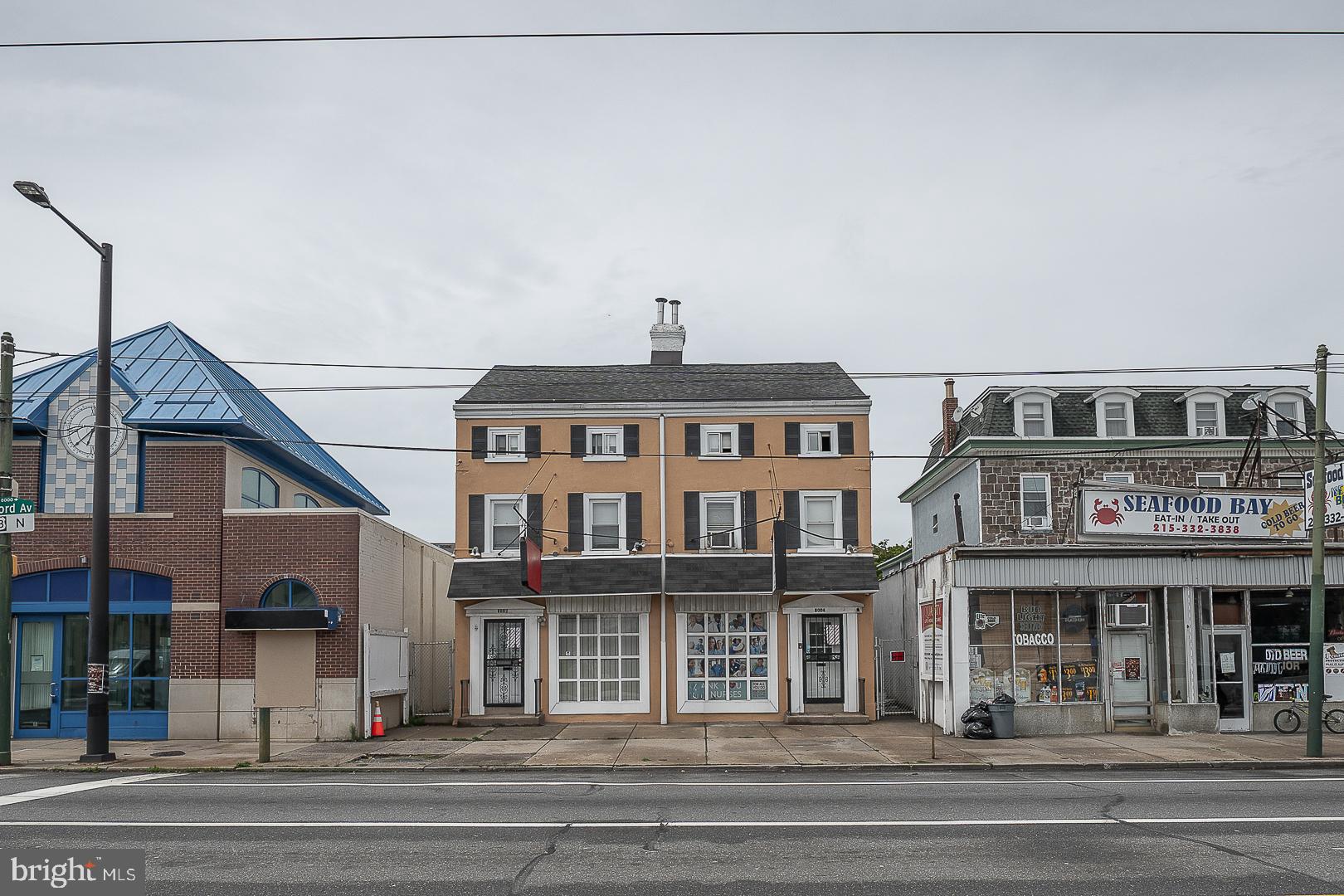 Prime mixed-use investment opportunity in the heart of Holmesburg! 8002-8004 Frankford Avenue offers two side by side, mixed use duplexes being sold together, creating a rare four-unit income-producing asset in a highly visible commercial corridor on Frankford Avenue. The portfolio consists of two first floor commercial spaces and two upper-level residential apartments, providing a desirable blend of commercial and residential income streams. The residential units are currently occupied and generating strong rental income of $1,350/month and $1,300/month. One commercial space is owner-occupied, while the second commercial unit is vacant, presenting an excellent opportunity for an owner-user, new tenant placement, or additional income growth. Each building features separate utilities, with tenants responsible for their own electric and gas. The owner currently pays water and sewer. The commercial units offer flexible layouts with basement access, while the residential apartments provide spacious living areas and attractive layouts that appeal to long-term tenants. Situated on a prominent stretch of Frankford Avenue in the thriving Holmesburg neighborhood, the property benefits from excellent visibility, strong traffic counts, convenient public transportation access, and proximity to shopping, dining, and neighborhood amenities. This is an ideal opportunity for investors seeking stable cash flow with value-add potential or business owners looking to occupy space while collecting rental income from the remaining units. Don't miss this unique chance to acquire two side by side, mixed use buildings with multiple income streams in one of Northeast Philadelphia's established commercial corridors.