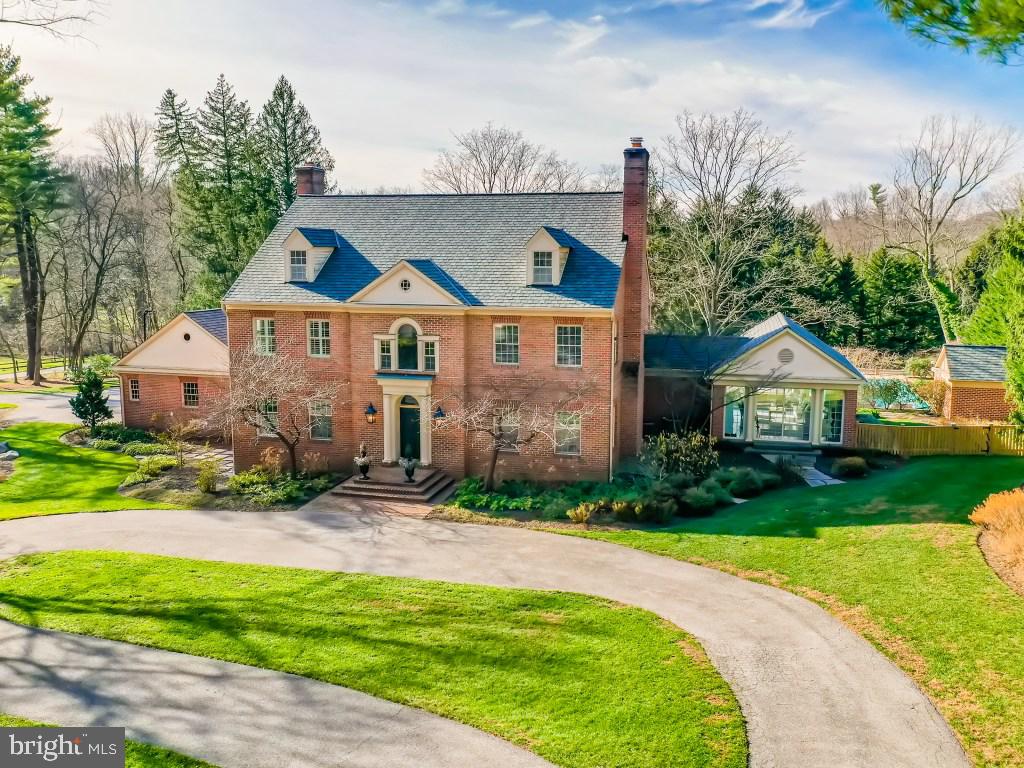 Spectacular custom built home in premier Ruxton location. Nestled on private 1.63 Acres, This 6BR, 5/2 BA has it all. Lorthorian heated salt water pool, spa, pergola, and pool house with mini kitchen. The perfect place to relax, entertain and enjoy the comforts of home. Large, gracious room sizes with10 ft+ ceilings. Exceptional gourmet kitchen fit for a chef. Large island, 2 dishwashers, 2 deep sinks, 6-burner Wolf Stove with Griddle and Gas Oven. Additional Electric Wolf Oven. Subzero fridge includes 2 beverage drawers, 2 additional freezer drawers and Subzero ice maker. Sleek mudroom/1st floor laundry room: 7 lockers with drawers for shoes, 2 washers, 2 dryers, additional sub zero freezer drawers (2) and  refrigerator drawers (2),  large island for folding and storage.  Seamless gathering spaces (family room, dining room and sunroom) with wonderful flow to inviting outdoor patio/lounge spaces and vistas of manicured backyard.  Two updated stylish fireplaces in the family room and living room. New custom cabinetry in foyer and office.   Luxurious master suite w/two walk-in closets.  All new doors with hardware. Rich hardwood flooring on all three levels. Lower level with exercise, study and entertaining area. Fun basketball Sport Court,  3-car garage plus extra storage bay with  walk up spacious second floor attic. Extras: whole house generator, extensive landscaping, new fence,  surround sound system. Gracious living spaces, combining casual elegance with comfort . You will always look forward to going home .