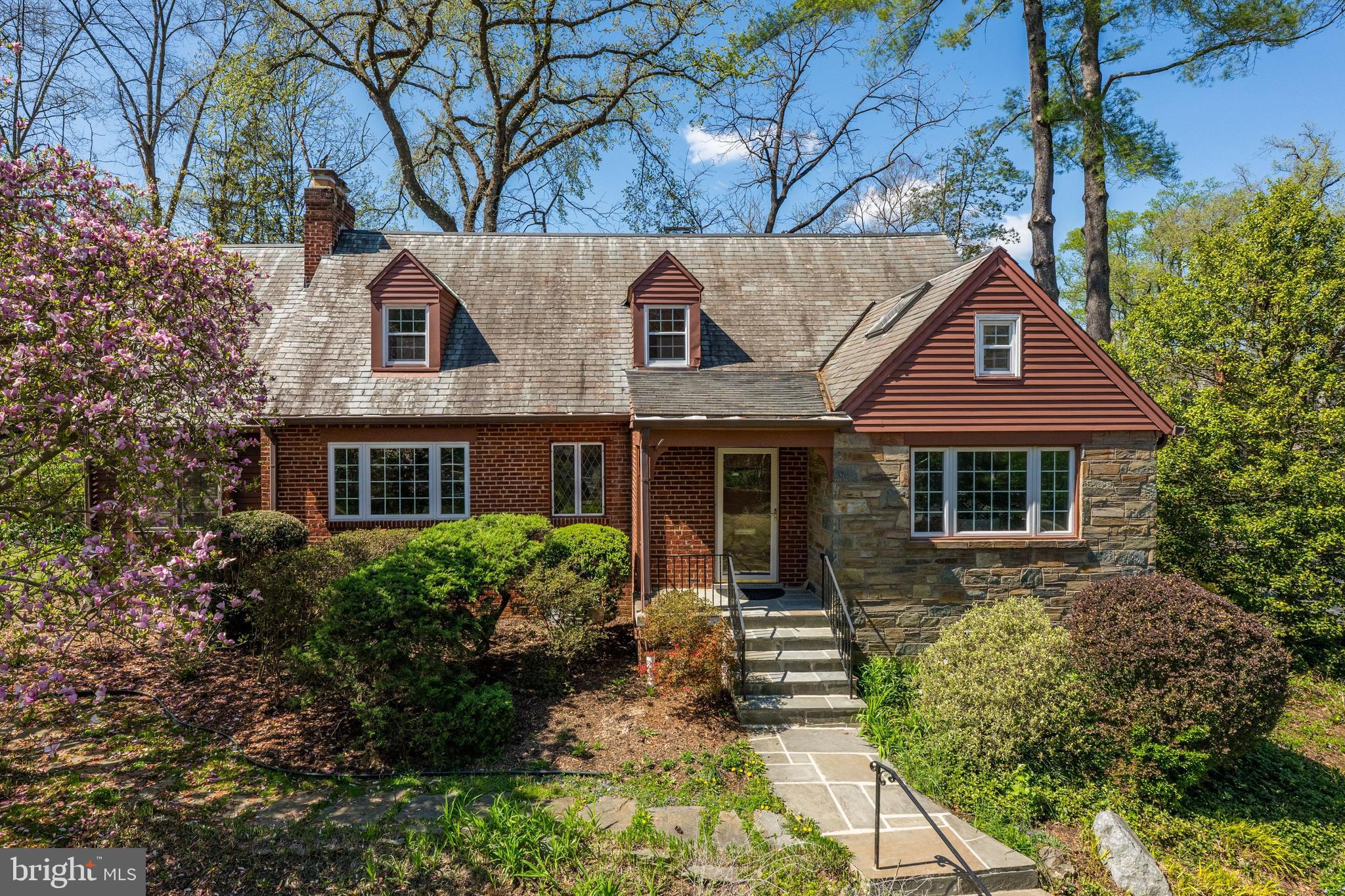 Nestled in the highly sought-after Rollingwood neighborhood of Chevy Chase, this beautifully maintained 1948 brick and stone Cape Cod—lovingly cared for by just two owners—offers timeless charm, exceptional space, and an unbeatable location just 1 block from Rock Creek Park, Meadowbrook Stables, tennis courts, trails, and the “Candy Cane City” playground.

Featuring a flexible 5–6 bedroom layout, including a main-level office with closet and access to the powder room (ideal as a guest room), this home blends classic architecture with thoughtful updates. Bright interiors showcase refinished hardwood floors, arched doorways, and a spacious living room with double-sided fireplace, built-ins, and a picture window, flowing into a sunroom with exposed brick and backyard access.

The kitchen includes stainless steel appliances, gas range, tiled backsplash, breakfast peninsula, and a Bosch dishwasher, with a formal dining room nearby. Upstairs, the primary suite features an en-suite bath with heated floors, plus three additional bedrooms and a hall bath. The finished lower level offers a large rec room with fireplace, new flooring, fifth bedroom, full bath, laundry, and workshop.

Additional features include double-pane replacement windows (approx.), multi-zone HVAC, and a whole-house attic fan. The fully fenced backyard features a stone patio, pond with waterfall, and mature landscaping. A 2-car garage and driveway parking for 4+ cars complete the home.

Ideally located minutes to Metro, downtown Bethesda, DC, and endless dining, shopping, and recreation. Zoned for Rock Creek Pool usage. The neighborhood is served by Rock Creek Forest ES, Westland MS, and Bethesda-Chevy Chase HS (buyer to verify with MCPS). Please note: Square footage is estimated and calculated by an independent third party; information is deemed accurate but not guaranteed.