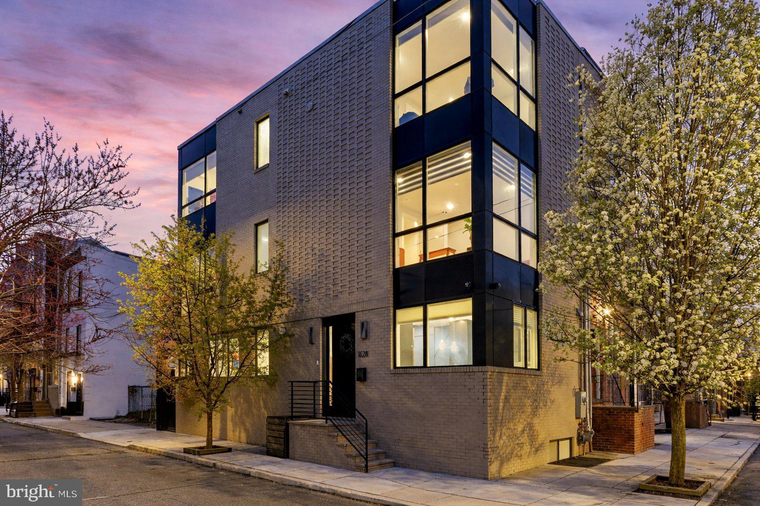 Welcome to this stunning corner townhome in the heart of Graduate Hospital. Spanning four levels of living space, this six-year-old residence is defined by soaring ceilings, expansive windows, and the rare luxury of an attached garage. The home’s corner orientation ensures an abundance of natural light throughout its thoughtful, open-concept floor plan.

The first floor offers a spacious layout that connects the living and dining areas to a high-end gourmet kitchen. Built for those who love to cook, the kitchen is equipped with professional Wolf and Sub-Zero appliances, custom cabinetry, and durable quartz countertops. On the second floor, you’ll find a versatile space perfect for an office or den with floor-to-ceiling windows and a private deck, alongside a primary suite featuring a spa-like bath and custom-built wardrobe cabinetry. The third floor holds two additional oversized bedrooms with large closets, a modern hall bath, and a laundry room for the ultimate ease of convenience.

For outdoor living, the home features a spacious rooftop deck with unobstructed, panoramic views of the Philadelphia skyline, perfect for hosting all year round. The property also includes a fully finished basement with extra high ceilings providing ample space for a gym or media room, as well as a full bathroom.

Perfectly positioned in one of the city’s most walkable neighborhoods, you are just steps from Rittenhouse Square and the vibrant dining and shopping of Center City. With an attached garage and easy access to major transit, this home offers an elevated lifestyle with every urban convenience at your doorstep.

Several years remaining on tax abatement.
