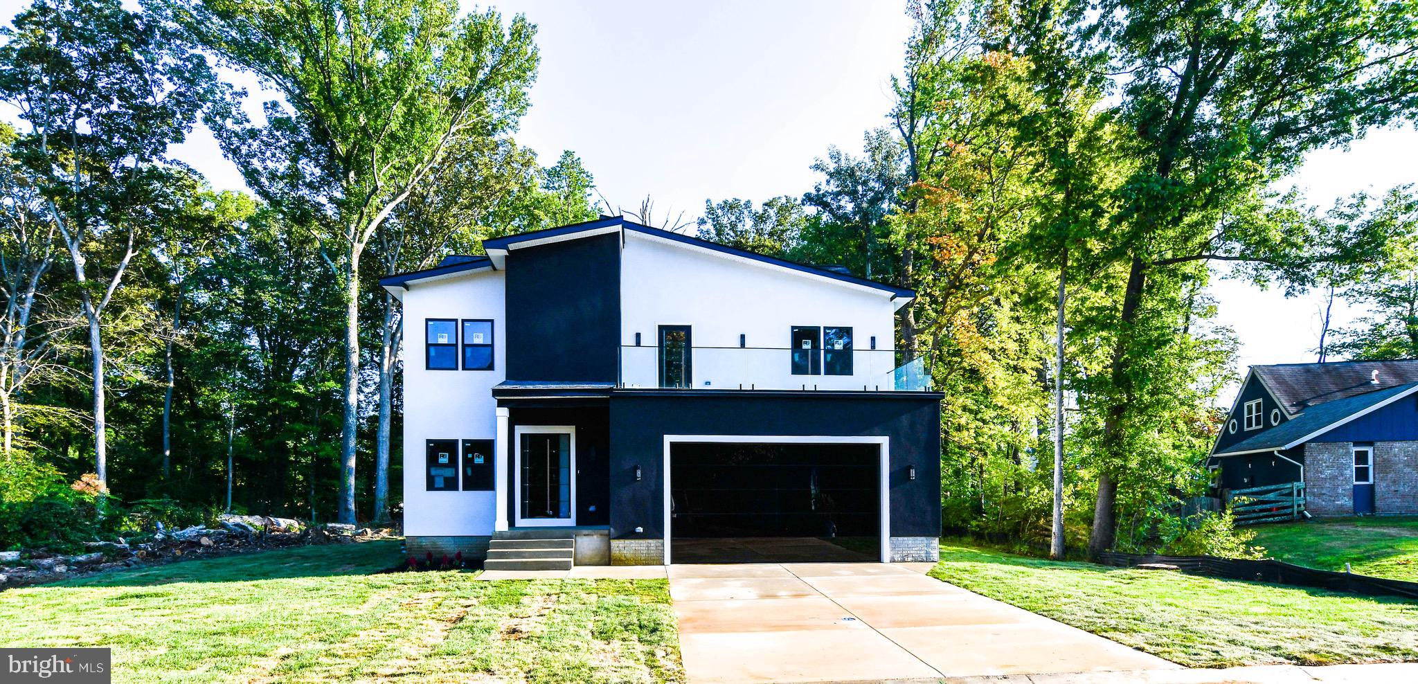 Buyer Financing Fell Thru -Brand New Construction Modern Home on a 1/2 Acre of flat land - No HOA Rules & No HOA fees:  5,000 Sq Feet of house on a private lot. We are Paying  $20,000 in Closing Costs Help.  

Over 100 Feet of private backyard space half wooded for privacy  - this would be perfect for a large pool, pool house, secondary garage space or outdoor Oasis!  Modern Contemporary Home comes with a Stucco finish with a stainless steel metal front door, glass balcony and glass mirror garage doors.  Move In Ready. 

6 Bedrooms, 4  Bathrooms Single Family House with Private Garage for 2 Cars with modern glass mirrored garage doors. This house has it all! Integrated Wireless Speaker and Audio System to play all your favorite music throughout the house.  Brand New Kitchen with SS Appliances, New Hardwood Floors throughout the main level, Glass Wine Cellar, Butlers Nook and Wet Bar in the owner suite. Main level comes with large 10 Feet Black Accordion Doors for easy access to your private backyard. Kitchen comes with a 8 Feet island and Walk In Closets in each bedroom. Inside boasts10 foot ceilings throughout the house. Includes two zone HVAC heating /Ac system throughout the house. 

Owners Suite comes with a large 25 Foot private glass balcony overlooking the neighborhood, perfect for nights of stargazing.

Full Basement comes with a finished bedroom, separate entrance and the remaining 1,500 Sq feet is currently unfinished. Basement does include two rough ins already installed for a full bathroom and basement wet bar. This area would be perfect for a separate office space, home based business, or in-laws, or AIR BNB.  NO HOA and NO Front Foot Charges. 

Property is located 1 mile from Bowie Town Center, 7 Miles from Crofton Shopping Center and 15 Miles from Annapolis.  Interstate 295, Route 301 and Route 50 are a 1 mile away.
  If not this lot, we have tons of lots available that come with all permits and approved floorplans, just reach out and ask for complete list of available flip projects and new construction lots.