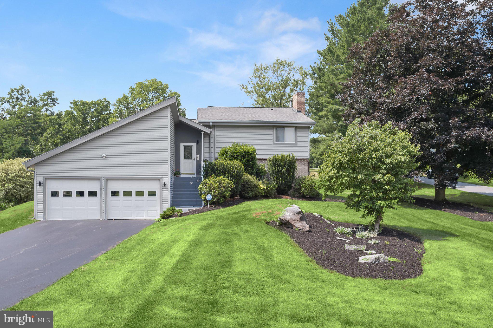 Welcome home to this beautifully maintained contemporary residence in highly sought-after Robinwood subdivision, where timeless charm, thoughtful updates, and exceptional indoor and outdoor living spaces come together to create the perfect place to call home. From the moment you arrive, you'll appreciate the home's inviting curb appeal, mature landscaping, oversized driveway, and spacious attached two-car garage. 
Step through the front door into a bright and welcoming stone tiled foyer that opens to an impressive main living area designed for both everyday comfort and effortless entertaining. The stunning living room is filled with natural light from expansive windows and showcases soaring vaulted ceilings accented by striking exposed wood beams, creating a warm, airy atmosphere. Brand new luxury vinyl plank flooring extends throughout the main level, adding both elegance and durability while complementing the home's inviting aesthetic.
The dining room offers the perfect setting for holiday gatherings, dinner parties, or casual family meals, flowing seamlessly into the spacious kitchen. Designed with functionality in mind, the kitchen features abundant cabinetry, generous countertop space for meal preparation, and an efficient layout that makes cooking and entertaining a pleasure. Just beyond the kitchen, the tongue & groove cedar walled sunroom serves as a peaceful retreat where you can enjoy your morning coffee, unwind with a good book, or simply take in relaxing views of the beautifully landscaped backyard throughout every season.
Upstairs, the private bedroom level provides a comfortable retreat for the entire family. The spacious primary suite offers a peaceful escape with brand new plush carpeting, complete with an en-suite bathroom and generous closet space. Two additional well-proportioned bedrooms, all also featuring brand new plush carpeting, provide flexibility for family, guests, or a home office. A nicely maintained full hall bathroom completes the upper level. Brand new plush carpeting has also been installed on both the ascending and descending stair cases to both the upper and lower levels.
The lower walk-out level expands the home's versatile living space with an oversized family room perfect for movie nights, game days, children's play space, or entertaining friends and family. Centered in the family room is a brick, gas fireplace perfect for cozying up on winter nights. This level also features a fourth bedroom, an additional full bathroom, a conveniently located laundry/utility room, & another room for storage w/ an additional outside access.
Step outside to discover your own backyard oasis designed for year-round enjoyment. The expansive deck has been recently power washed and beautifully re-stained, providing the perfect setting for outdoor dining, summer barbecues, or relaxing evenings under the stars. A spacious patio and gazebo with a hot tub create multiple areas for entertaining or unwinding after a long day. The beautifully landscaped yard offers plenty of green space for recreation, gardening, or pets to enjoy, while the workshop above the garage and storage shed provide exceptional space for hobbies, projects, lawn equipment, and additional storage.
Lovingly cared for and thoughtfully updated, this exceptional home offers the perfect combination of spacious living areas, flexible floor plan, tasteful improvements, and incredible outdoor amenities. With brand new LVP flooring throughout the main level, new carpeting upstairs, beautifully refreshed outdoor living spaces, there room for everyone to spread out and enjoy!