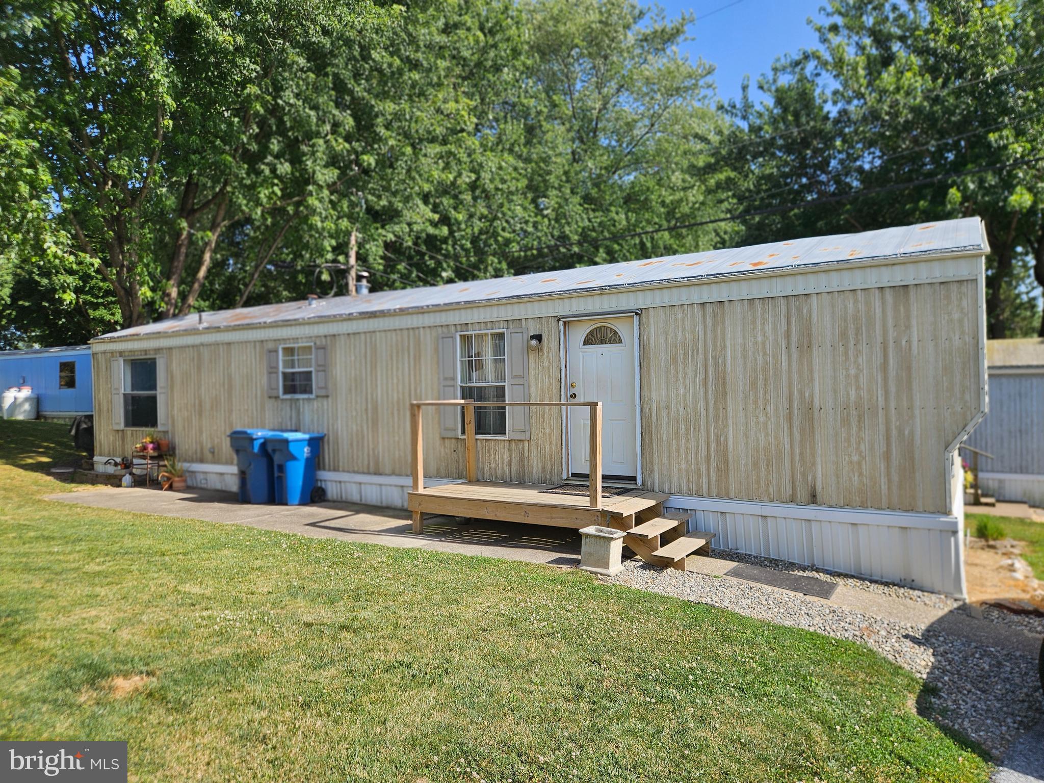 Affordable one floor living and built in 2005 makes this unit a solid choice.   This home has 2 bedrooms, living room, eat in kitchen leading to the laundry area and full bathroom.  The bedrooms are located at either end.  All appliances are included with acceptable offer.  If you enjoy sitting outside, there is a cement slab perfect for outdoor furniture.  Willow Farms mobile home park is located in a rural area near Strites Orchards in Chambers Hill.  Pets are allowed however there are breed restrictions for dogs.   Mobile homes require special financing, personal loan, or pay with cash and buyer would need to get park approved.  Watch the video tour and schedule your showing today!
