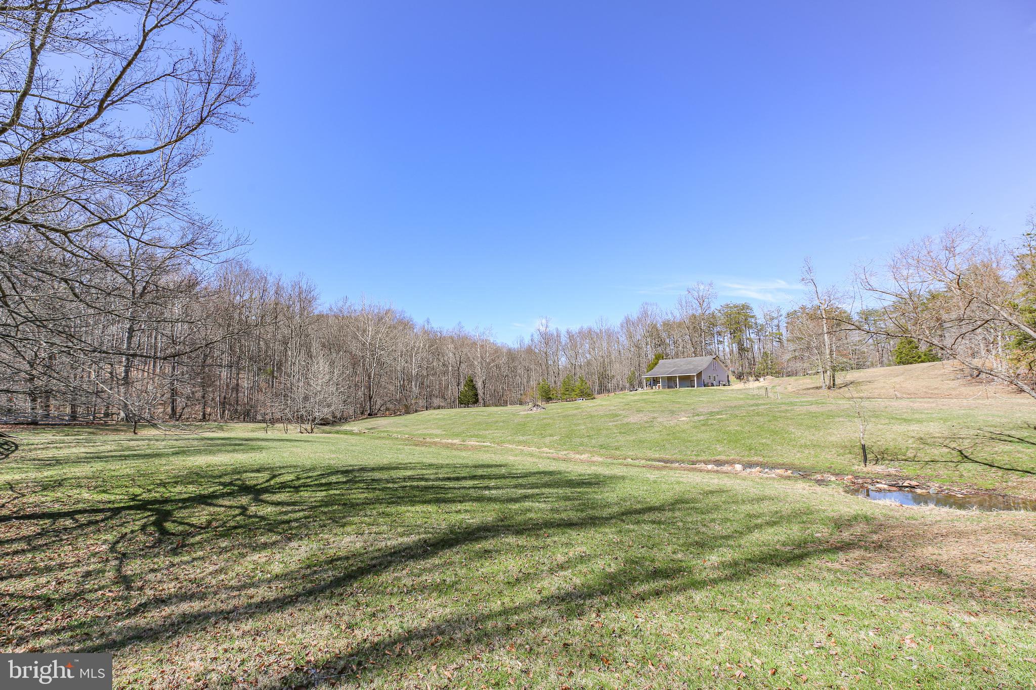 RARE OPPORTUNITY to own 26 stunning acres in a sought-after equestrian community featuring beautifully maintained riding trails throughout. Whether you’re ready to build your dream home or simply create the perfect retreat for your horses, this property offers endless possibilities.
An existing barn is already in place, along with road access and a gravel driveway for added convenience. The groundwork has been started for you. Soil testing has been completed and approved for a septic system, and a well permit is already in place.
Bring your horses, donkeys, chickens, and goats, and enjoy the freedom of country living. Explore scenic trails that wind through peaceful woods and alongside natural streams, or take advantage of the opportunity to hunt on your own land. Plat in documents.

This is a unique chance to own a private, versatile property in a truly special setting.