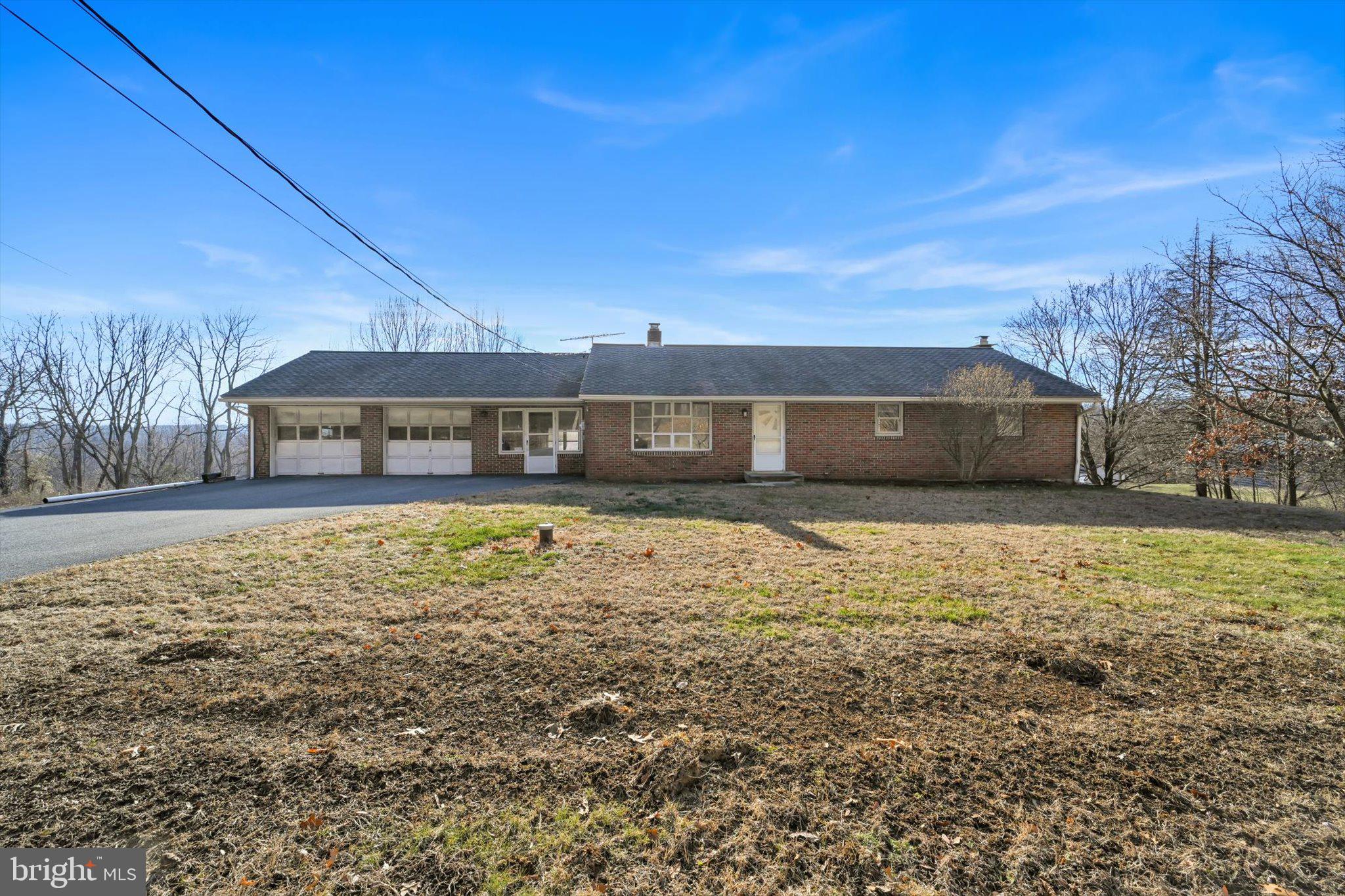 Brick ranch home built in 1972 offering three bedrooms, one and a half baths, and a two-car garage. Owned by the same owner for 52 years, this well-cared-for home features hardwood floors throughout and an open kitchen and dining area ideal for everyday living and entertaining. The walkout lower level includes an 18’ x 14’ recreation room, generous storage space, and a brick hearth with the option for an additional heat source. A 12’ x 20’ storage shed provides even more storage. Situated on a gently sloping one-acre lot, the property offers peaceful views of surrounding fields and woods. *Check out the floor layout for all the workshop space along with ample storage areas.