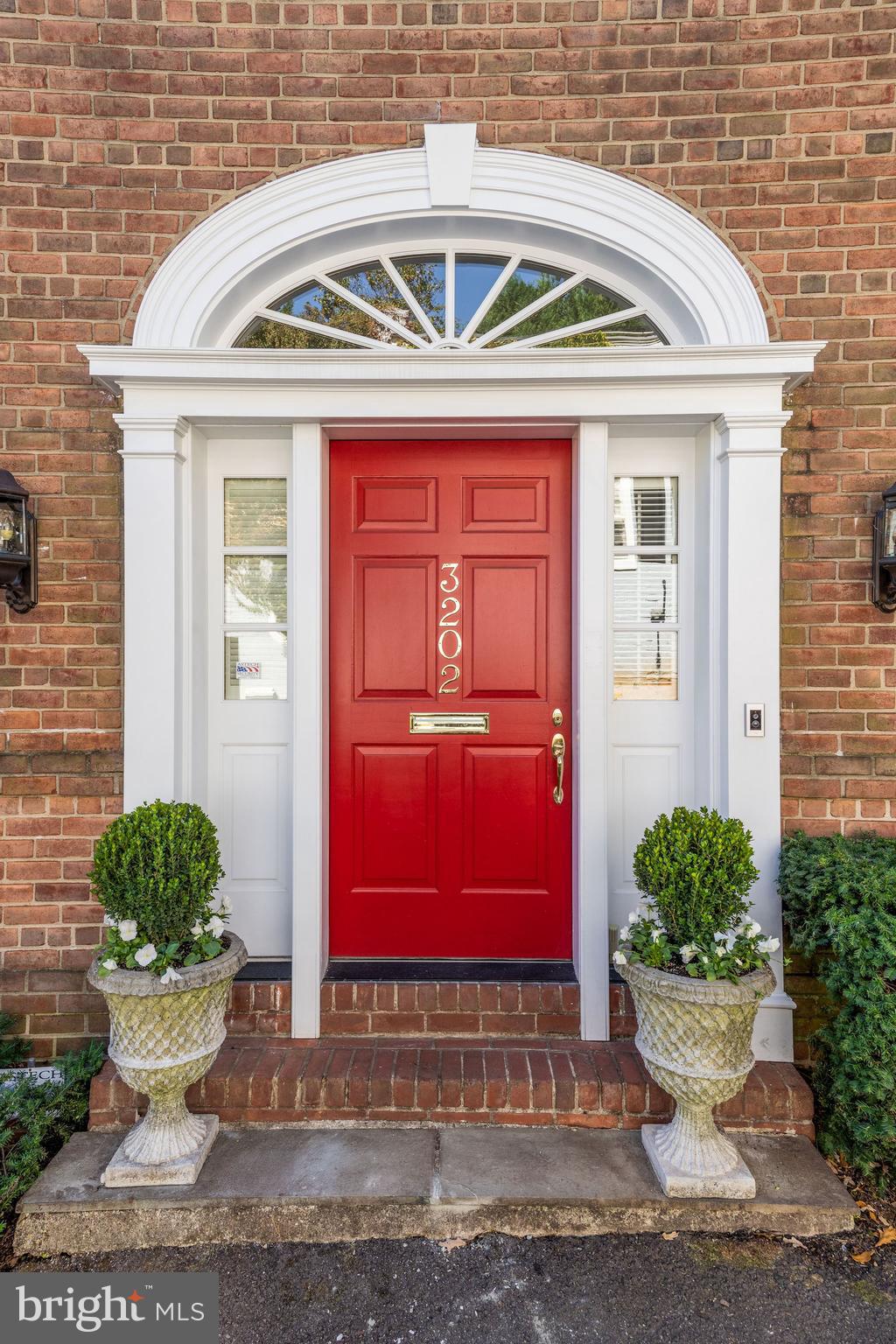 This one-of-a-kind semi-detached townhouse is nestled in Georgetown’s East Village, a quiet oasis conveniently located near Wisconsin Avenue. Expertly redesigned by renowned DC Architect Ankie Barnes, this stunning home features original details throughout its updated floor plan now catered towards today's living. Complete with 10ft ceilings and hardwood floors, the Main Level includes a gracious Living Room with original fireplace, south-facing Family Room with fireplace, bay window overlooking Patio, built-in Bar with beverage fridge and sink, Powder Room, large Dining Room, elevator, and recently updated eat-in Kitchen with center island and stainless-steel appliances. Main Level is perfect for entertaining as the Living, Family, and Dining Rooms all enjoy direct access to the private flagstone Patio. Sunlit Second Level with south-facing windows includes Primary Suite with spacious Bedroom featuring fireplace and custom built-ins, large walk-in Closet with built-in dressers, and luxurious en-suite Full Bath. Second Level also features gracious Guest Suite with en-suite Full Bath and convenient Bonus Room with California Closet and auxiliary washer/dryer. Flexible Third Level features a large bedroom with shared access to a beautifully renovated bathroom along with a light filled office/bedroom and an all-purpose room. Lower Level offers abundant storage space and a guest suite with full kitchen, bathroom and independent entrance. Complete with a 1-Car Parking Pad with direct access to Patio through private gate plus easy On-Street Parking.