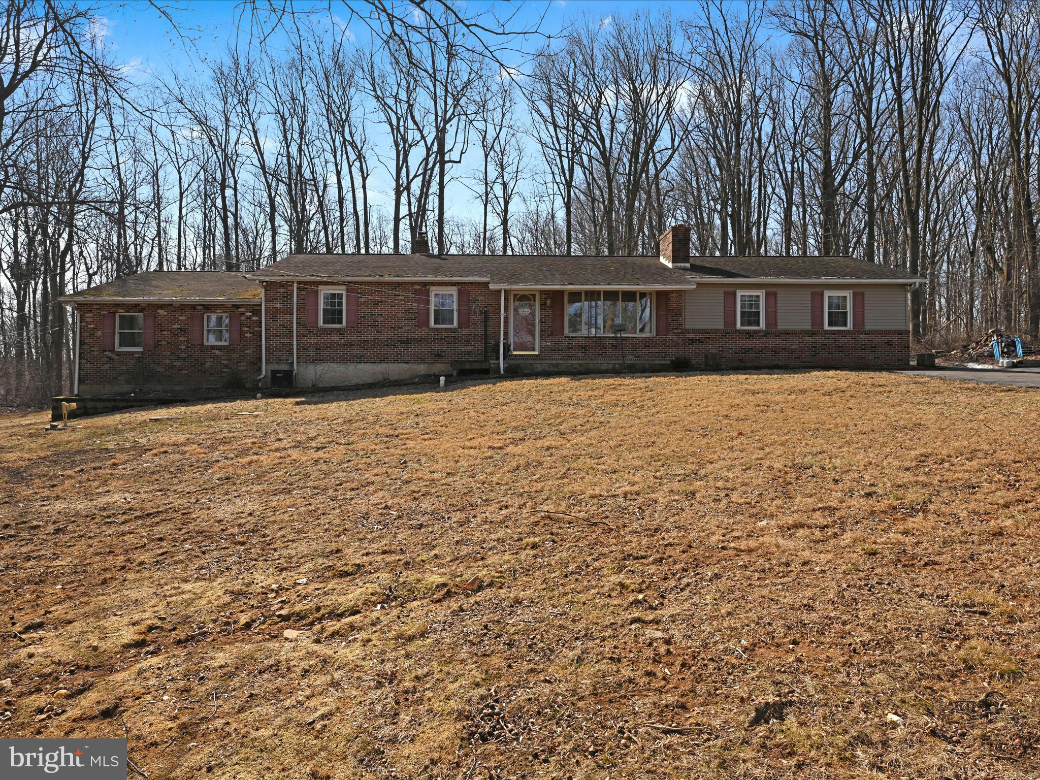 Nestled down a long driveway, you will find a spacious lot with a private backyard for entertaining. The four bedroom two bath house is more than meets the eye. It has a lower level with a separate bedroom and bath. Lot's of possibilities there! Come add your finishing touches...