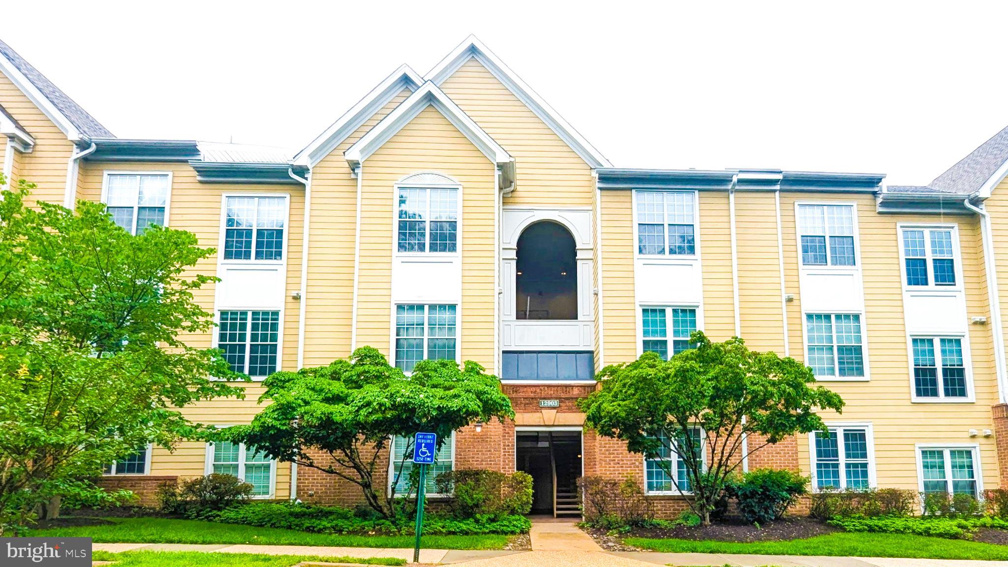 Ground-level, no-stairs 2BR/2BA condo in Worldgate with 1,140 sq ft, private balcony, gas fireplace, in-unit washer/dryer, and updated kitchen and baths. Open living/dining area with engineered hardwood, recessed lighting, and direct access to the balcony. Kitchen features granite counters, stainless steel appliances, and breakfast bar. Primary suite offers walk-in closet and refreshed bath with dual vanity and glass shower. Condo fee includes water, trash, snow/lawn/road/exterior maintenance, plus pool, fitness center, clubhouse, and walking paths. Minutes to Herndon Metro Silver Line, Dulles Airport, Reston Town Center, W&OD Trail, Toll Road, Route 7, and Route 28. Owner-occupied with easy same-day showings by appointment, during weekdays M-F between 10-5.