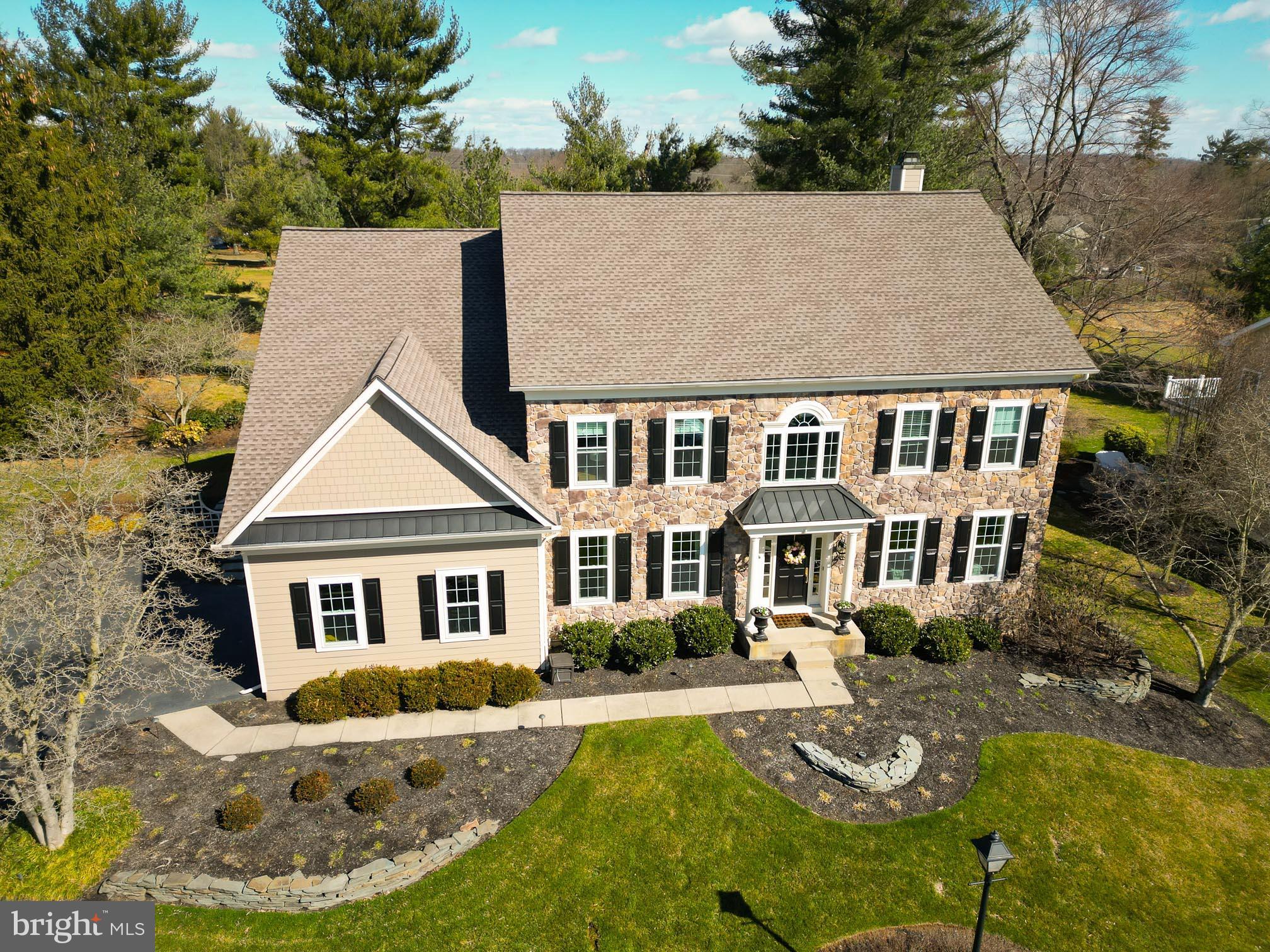 Located on the scenic 3rd fairway of sought-after Talamore Country Club, this spectacular residence epitomizes comfortable yet elegant living. With four bedrooms and 2.5 baths, it's an exceptional haven of relaxation and warmth, boasting custom finishes that add a personal touch to every corner. As you step into the foyer, you're greeted by a striking two-story entrance, complete with a stylish nook and a dazzling chandelier, setting the welcoming tone for the entire home. The light-filled, open-plan main floor flows seamlessly, offering new field-finished hardwood, a sleek living room with a unique feature wall, a sophisticated dining room with crown molding, and a two-story family room that's perfect for gatherings, complete with an artisan-made cherrywood mantel and a gas fireplace. The kitchen steals the spotlight, with its gourmet setup featuring custom cherry cabinets, top-of-the-line appliances, and a casual dining area that leads to the deck and garden via a 3-panel Pella slider. Nearby, a den/home office provides a tranquil space with garden views, ideal for work or relaxation. The laundry room/pantry with spacious cabinets and granite countertop provides ample storage and staging space to make entertaining a breeze. And for added convenience, there's a lovely powder room with custom touches and granite countertops. You can choose which staircase to take to the second floor, where you’ll find the expansive primary bedroom, offering vaulted ceilings, a sitting room with custom built-ins, and a private deck overlooking the lush fairway. The ensuite bathroom is a luxurious retreat with a Jacuzzi tub, shower, and custom vanities. Three more spacious bedrooms and a hall bathroom with modern amenities complete the second floor, providing comfort and space for everyone. The basement is a versatile space, with a large carpeted area that's perfect for workouts or play, and ceilings high enough to envision additional living space. Storage is plentiful, ensuring clutter-free living. Outside, the thoughtful design continues with lush gardens and inviting outdoor spaces, including upper and lower decks, a bluestone patio, firepit, and mature plants that add to the natural beauty. It’s the perfect setting for a quiet cup of coffee to start your day or cocktails with friends to end it. A two-car garage, landscape lighting, and security system provide peace of mind, while the front yard in-ground sprinkler system ensures a lush, green lawn even during summer’s hottest days. Well-maintained and updated, this home offers practical comforts like a new roof, stone façade, Hardie Plank siding with AZEK trim for a luxury but low-maintenance feel, windows, and a whole-house generator – all updated within the last 5 years. With its blend of comfort and style, it's a place where luxury meets everyday living, inviting you to relax, entertain, and make lasting memories in a setting that feels just like home. Talamore residents enjoy easy access to a 3-mile loop walking path, plus the country club’s Har-Tru tennis courts, resort-style pool, gym, and clubhouse with several dining options. Located near Springhouse, Montgomeryville, and the vibrant town of Ambler, this exceptional residence offers easy access to shopping, services, and dining, whether you’re checking items off your to-do list or looking for a lively night out. Its proximity to major roadways and regional rail lines ensures effortless travel to points near or far. You’ll love exploring Ambler, with its quaint boutiques, diverse dining options, and energetic community atmosphere. Meet your new neighbors for a movie night at the historic Ambler Theater, one of the oldest movie theaters in the country, and afterward walk to dinner at one of the nearby restaurants. With its thoughtful design, high-quality finishes, country club amenities, and all the nearby activities, this beautiful home offers exceptional lifestyle. What are you waiting for? Call for your showing TODAY!