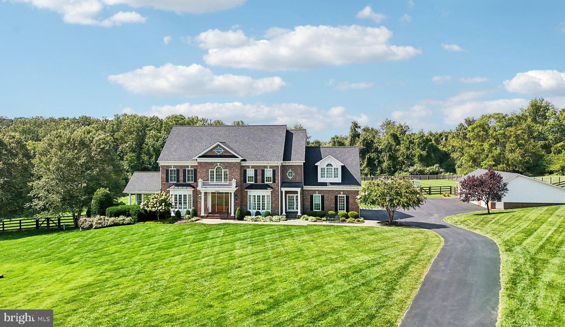Welcome to 14930 Finegan Farm Drive in Darnestown,  MD!  This stunning 6-bedroom, 5.5-bathroom home is set on a sprawling 4-acre lot, offering a perfect blend of luxury and comfort. Step inside to a grand foyer with a curved staircase and gorgeous crystal chandelier that sets the tone for this exquisite home. This beautifully transformed interior features a formal living room and dining room both with oversized bay windows and exquisite crown moldings, ideal for elegant entertaining. The family room is a showstopper, boasting a two-story coffered ceiling, floor-to-ceiling windows, and a two-story stone fireplace. 

The one-of-a-kind Jack Rosen custom kitchen is sure to delight any culinary enthusiast. With an African Teak countertop island, a semi-integrated refrigerator, and high-end appliances, accompanied by a charming fireplace this kitchen is a dream come true for any chef.  Off the kitchen, you’ll find an IPE deck overlooking the serene backyard.  To complete the main level there is a custom mudroom with cubbies, one of two laundry rooms, a main level office with built-ins, and a charming circular sunroom with a two-sided fireplace and floor-to-ceiling windows that flood this space with natural light   perfect for relaxation and enjoying morning coffee.

On the upper level, the primary suite continues to impress with its vaulted ceiling, fireplace and sitting area, a spa-like bath, and his & hers custom walk-in closets. Three additional bedrooms are generously sized, making them perfect for guests, a home office, or any other need you envision. There is a second laundry room on this  level.  The fourth level includes a private bedroom, a fully updated bath, and a sitting room, offering even more living space and flexibility.

The lower level is an entertainer's paradise, featuring a large rec room with a herringbone wood grain tile floor, a cozy stone fireplace, wet bar, and a game table area. It also includes a sixth bedroom, a full bath, an exercise room, and direct access to the covered patio, a heated pool with water features, a natural flow outdoor shower, and a gorgeous backyard that feels like you're at a high-end resort   perfect for hosting indoor-outdoor gatherings.

In addition to the attached 2-car garage, the property offers a separate 4-car garage, providing ample space for vehicles and extra storage. This property exudes luxury, combining modern elegance with unparalleled amenities. Don’t miss the opportunity to make this exceptional property your home!