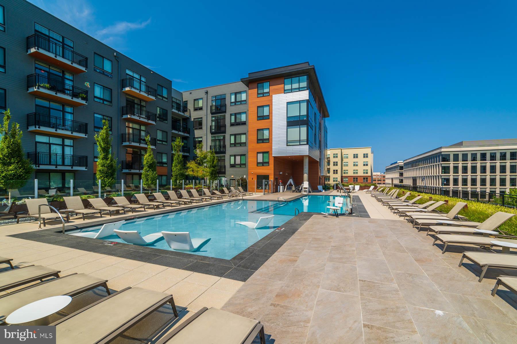 Urban Contemporary Meets Resort-Style Luxury at National Harbor

Welcome to 145 Riverhaven #550, a pristine, top-floor residence where luxury, comfort, and sophisticated design seamlessly converge. From the moment you step inside, the open-concept layout effortlessly connects the kitchen and living spaces, creating an immediate sense of scale and modern elegance.

Inside the Residence
Designer Kitchen: A culinary masterpiece featuring striking two-tone cabinetry that adds exceptional depth. The centerpiece quartz island anchors the space, perfectly complementing the premium countertops and a full suite of stainless-steel appliances (including a built-in microwave).

Private Courtyard Balcony: The bright living room extends outdoors to a private balcony overlooking a serene, beautifully landscaped courtyard—your personal urban oasis.

Spacious Owner’s Suite: A generous bedroom designed to easily accommodate a king-size bed, paired with a massive walk-in closet and a refined bathroom complete with a stylish vanity and a soaking tub/shower combination.

Everyday Conveniences: Enjoy the ultimate ease of an in-unit stackable washer and dryer, alongside one dedicated, covered garage parking space.

World-Class Amenities at The Haven
Live like you are on vacation with 15,000 square feet of exclusive, resort-style amenities right at your fingertips:

Relaxation & Recreation: A sparkling pool with private cabanas and a grilling area, a cozy lounge with a statement fireplace, and a community clubroom equipped with a pool table, entertainment kitchen, and flat-screen TVs.

Modern Essentials: Co-working stations distributed throughout the building for seamless remote work, a dedicated pet spa for your furry companions, and a 7-day a week concierge service to manage your everyday needs and secure package retrieval.

The Ultimate Connected Location
Situated in the heart of National Harbor, you are just steps away from world-class dining, vibrant nightlife, and premier shopping.

Seamless Commuting: Close proximity to I-95/295/495, MGM National Harbor, Tanger Outlets, Joint Base Andrews, Joint Base Anacostia-Bolling, the Pentagon, and downtown Washington, D.C.

Leisure & Lifestyle: Enjoy local bike and walking trails, or catch the Water Taxi for a scenic ride across the river to Historic Old Town Alexandria or The Wharf.

This isn’t just a place to live—it is the lifestyle upgrade you have been searching for. Schedule your private tour today and welcome home!