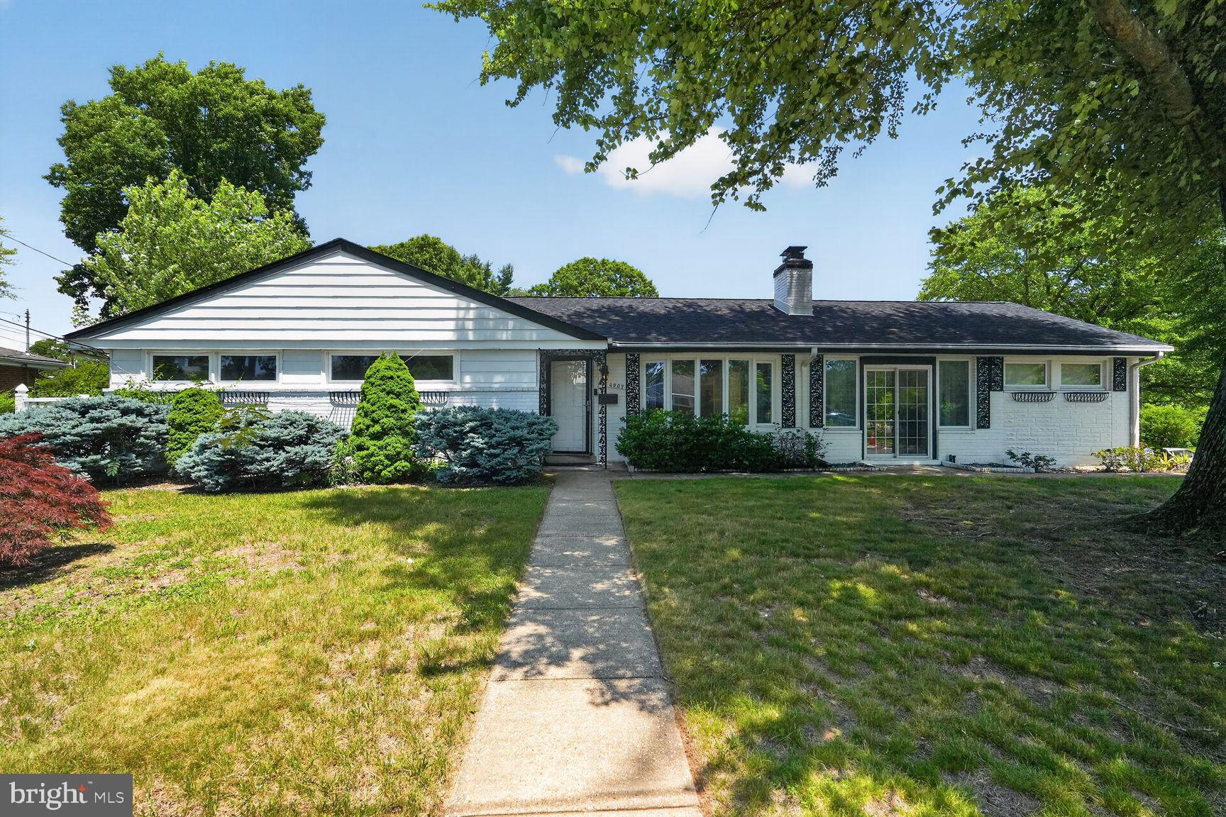 Welcome to 4202 Yates Road, a spacious and beautifully updated ranch-style home offering exceptional flexibility, modern upgrades, and over two levels of comfortable living space. Freshly painted throughout, this home features newly refinished hardwood floors, new quartz countertops, remodeled bathroom, a new HVAC system, upgraded electrical panel, 80-gallon hot water heater, and efficient three-zone HVAC for enhanced comfort. The main level is thoughtfully designed to accommodate a variety of living arrangements. The private primary suite includes its own full bath, while a separate in-law or guest suite offers another full bath for added privacy. Two additional bedrooms and a third full bathroom complete the sleeping quarters. The inviting living room features a fireplace as its focal point, creating a warm and welcoming atmosphere. The kitchen has been updated with beautiful new quartz countertops and opens to a breakfast room. Just off the kitchen, the spacious family room provides additional gathering space and opens onto the front patio, perfect for relaxing and entertaining. The walk-out lower level dramatically expands the living space and is ideal for multigenerational living, guests, hobbies, or entertainment. Highlights include a large recreation room with a wet bar, an additional bedroom and full bath, a private office/den, exercise room or flexible-use space, and a professionally designed climate-controlled music studio. Outside, enjoy the fully fenced rear yard featuring a large patio, storage shed, and plenty of space for outdoor activities. The double-wide driveway provides parking for up to four vehicles. Combining the convenience of main-level living with an expansive walk-out lower level and numerous recent improvements, this exceptional home offers versatility, functionality, and outstanding value in a convenient location close to shopping, dining, parks, and major commuter routes.