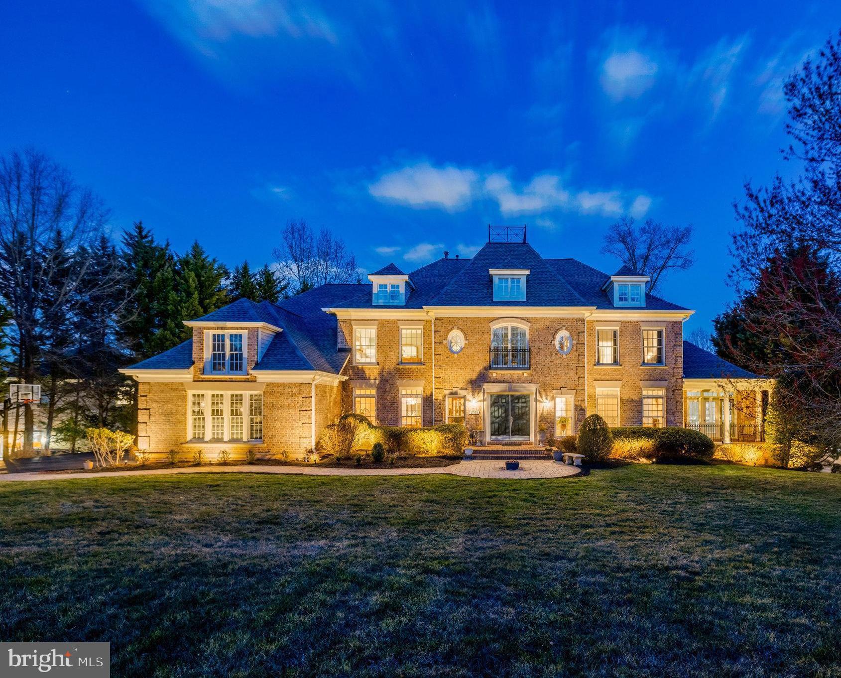 Experience the epitome of luxury living in this exquisite estate where sophistication and seclusion harmonize. Built by Renaissance, the Grand Monet model is truly unique and a premium top-selling design. Nestled on a one of a kind lot with unmatched lake views from the comfort of your home, this exceptionally rare gem surpasses expectations of meticulous craftsmanship and unrivaled entertainment options, redefining the concept of a refined lifestyle. A work of art in itself, this extraordinary residence showcases a chef's dream gourmet kitchen, two-story grand family room and beautiful landscaping. The allure commences upon entering the family room, where stunning views of the lake instantly captivate. The inviting open kitchen serves as the perfect setting for intimate dining experiences with loved ones or hosting memorable gatherings with friends. Multiple walk-outs grant effortless access to the backyard oasis, enveloping you in serene relaxation amid nature's embrace. Unwind on one of your many decks while savoring the aromas of a grilled feast, losing yourself in a fascinating book, or reveling in a refreshing beverage, uninterrupted by any distractions. Prepare to be fascinated by the astounding exterior, which leaves a lasting impression even in the evening as the enchanting moonlight reflections on the lake are incomparable. The private property sets the stage for various recreational activities, be it a lively game of football, soccer, basketball, or even a leisurely game of croquet as the sun sets. The lower level boasts a grand living area, offering a truly unparalleled space with multiple bedrooms, a full bathroom, bar area and personal at-home gym. A one of a kind home for making timeless memories that will last a lifetime.