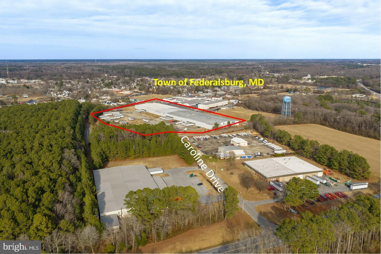 This 178,000-square-foot industrial facility sits on 15.40 acres within an Opportunity Zone. The building features clear heights of 31 feet at the center and 24 feet at the eaves, along with 16 dock doors (including three pit docks), two drive-in doors, and a fully sprinklered dry-pipe fire protection system.

The property currently generates $70,772 annual income. Approximately 30,000 square feet is leased, leaving 148,000 square feet available for an owner-occupant or additional tenant. Additional revenue is derived from leases on a portion of the parking lot and adjacent grassy areas, while still preserving ample acreage for future parking expansion or site improvements.

Located within the Caroline Industrial Park, just one-half mile from downtown Federalsburg and minutes from Maryland Routes 318 and 404, the property benefits from excellent regional accessibility. The industrial park is fully served by electricity, natural gas, public water and sewer, broadband internet, paved roads, and dedicated fire and police protection, making it an ideal location for manufacturing, warehousing, distribution, and logistics operations.

The property's strategic Mid-Atlantic location provides convenient access to several major ports, including Baltimore (80 miles), Philadelphia (124 miles), Norfolk (170 miles), and New York (207 miles). The surrounding region also offers a skilled workforce, competitive operating costs, and a business-friendly environment that supports continued growth and investment.