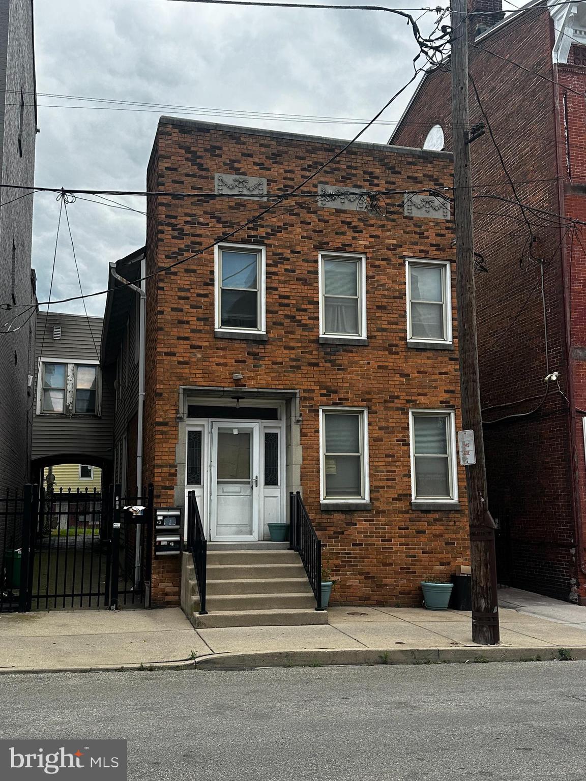 Offering a fully occupied multi‑unit opportunity in the heart of York’s Royal Square / Olde Towne East corridor. This walkable location places residents steps from downtown amenities, restaurants, galleries, and the city’s largest concentration of public art. The building retains original architectural details, including stone lintels along the upper façade, reflecting the craftsmanship of early York construction. With stable tenancy and strong rental demand in the surrounding district, this property serves as a reliable addition to an investor’s portfolio. This property may be paired with the neighboring building at 146 S Duke Street (listed separately), offering investors the rare opportunity to control two adjacent multi‑unit assets in a high‑demand rental district.