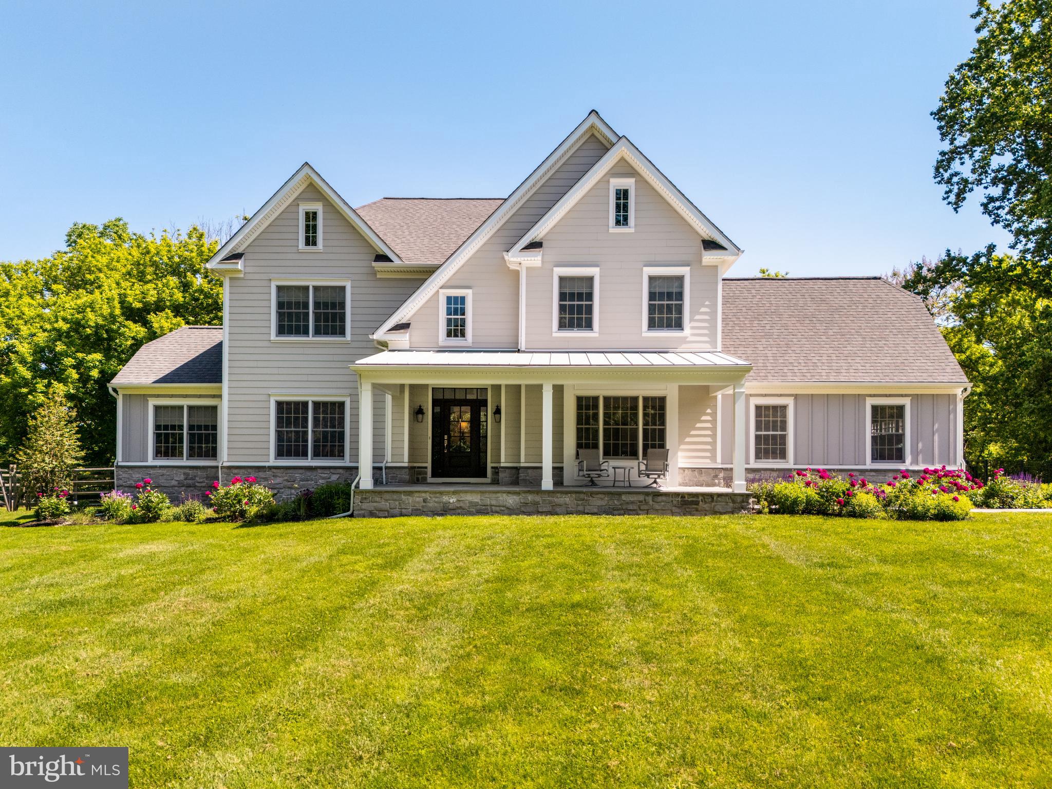 Experience two plus acres of peaceful beauty surrounded by nature on this private lot!  This 4-bedroom haven in Whitemarsh Township offers just that – escape from the daily grind without sacrificing convenience. Step inside the grand two-story foyer, a warm welcome to your completely refreshed home. The entire property has undergone a transformation, both inside and out. Exterior and interior design is by award winning architect Asher Slaunwhite + Partners, Jenkintown, PA with natural landscape planning by Terren Design, Conshohocken. The exterior boasts a brand-new look with gleaming siding, stylish doors, and a gorgeous rear deck, perfect for extending your living space and enjoying the huge back yard.
The heart of the house lies in the large eat-in kitchen, completely redesigned for easy socializing as well as serious cooking. Imagine gleaming new appliances, stunning granite countertops, and ample storage space – a chef's dream come true.  A perfect space for meals with loved ones and cozy evenings by the wood burning fireplace in the adjoining family room. Need a dedicated space for work or hobbies? The versatile living room seamlessly connects to a private bonus room, ideal for an in-home office or a quiet reading nook. Hosting a dinner party? The formal dining room, adorned with crown molding and bathed in natural light, provides the perfect setting. Enjoy lazy afternoons reading under a shady tree or hosting barbecues on the gorgeous, expansive rear deck, creating memories that will last a lifetime in the huge fenced in backyard 
The convenience factor doesn't end there. The first floor boasts a laundry room, a powder room, and a two-car garage for ultimate ease. Imagine waking up to sunlight streaming through the windows of your sprawling and luxurious primary suite, a private sanctuary with dual walk-in closets, a spa-like bathroom, and a separate sitting room bathed in sunlight from a skylight. The three other bedrooms are equally impressive and share a beautifully updated hall bath.
But wait, there's more! The finished basement, with its high ceilings, impressive millwork, and inviting atmosphere, offers endless possibilities. Create a recreation room for game nights, a dedicated home gym, or a spacious play area for the kids. A full bathroom adds to the functionality of this incredible space.
This stunning home in Whitemarsh Township in top-ranked Colonial School District truly has it all – peaceful seclusion, ample space, and the convenience of being close to major roadways, Chestnut Hill, Ambler, Conshohocken, and more. Don't miss out on the opportunity to find your haven.
