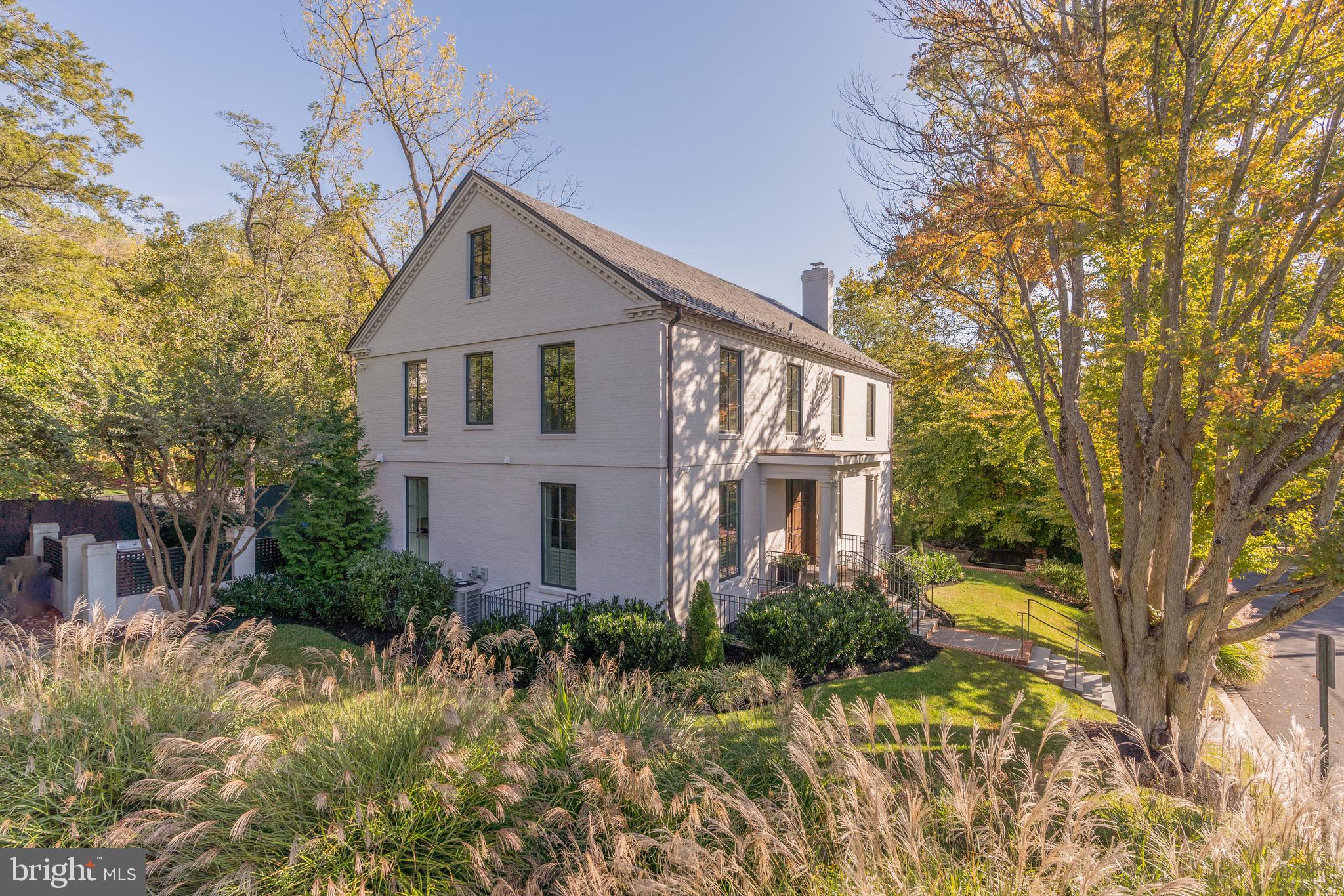 Immerse yourself in the epitome of contemporary living with this immaculate residence, thoughtfully reimagined and meticulously crafted from the ground up in 2018. This remarkable 6-bedroom, 6.5-bathroom home features premium materials throughout, and a well-organized main level with an expansive kitchen/family room including an indoor/outdoor fireplace creating the ideal central gathering space of the house. The main level feels fully incorporated with the outdoors thanks to the oversized Pella windows on all sides and multiple French doors. A separate dining room, powder room, and office complete the main level. The second level offers 3 bedrooms, each with en suite bath, including the gorgeous primary bedroom suite on the rear corner of the house, overlooking the park. The primary bedroom also includes floor-to-ceiling windows to allow maximum light and exposure to serene park views. There is a washer-dryer on this bedroom level. The 3rd level offers a large bedroom or flex space, plus an additional full bath. The fully finished lower level includes a recreation/media room with built-in surround sound, and 3 more bedrooms, plus 2 more full baths. The lower level layout provides many functional options, for additional home offices, a gym, or guest rooms. You will also find a secondary washer-dryer as well as ample storage on the lower level. The lower level is on grade with the parking area, providing smooth access. The rear patio is accessed directly off the main level, and on the terrace below there is a yard space also overlooking the park. The gated motor court provides off-street parking for 3-4 cars. 4401 W is located across the street from the luxury development of Phillips Park, and the convenience is unrivaled: Berkley is within close proximity to top schools, a short drive to Georgetown and downtown DC, and a quick commute to Reagan National and Dulles International Airports.