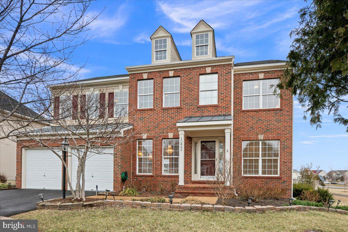 This stunning 4-bedroom, 3.5-bath model home, built in 2003, offers 4,257 sq. ft. of beautifully designed living space on a meticulously landscaped corner lot with an attached 2-car garage. Freshly painted throughout, the home features a gourmet kitchen with elegant cherry cabinets and a built-in desk area, a formal dining room accented with grasscloth wallpaper detailing, a sun-soaked sitting room, a cozy family room centered around a gas fireplace, and a versatile main-level office or library. A built-in intercom and stereo system offer effortless communication and whole-home musical entertainment. Upstairs, the spacious primary retreat offers a private sitting room and a wet bar, perfect for morning coffee, with space for a beverage fridge. The suite also includes a generous walk-in closet and a grand ensuite bath with double vanity sinks and a Jacuzzi tub. Three additional generously sized bedrooms and another beautiful full bath complete this level. The fully finished basement offers additional living space, featuring a large den or guest room, a full bath, and walkout access to the backyard. Step outside onto the low-maintenance Trex deck, complete with a custom electric awning, perfect for outdoor entertaining. The fully fenced backyard is a private oasis, featuring a charming herb garden with mint, parsley, cilantro, and chives. Surrounding the home is extensive landscaping, supported by a seven-zone irrigation system with a subtraction meter ensuring the owner is not charged for sewer on water used to irrigate. Landscaping highlights include Kwanzan trees, cherry blossoms, fig trees, roses, tulips, hydrangeas, hyacinths, peonies, crape myrtle, and dahlias. Conveniently located near shopping, dining, and major commuter routes, this exceptional home seamlessly combines style, comfort, and convenience.