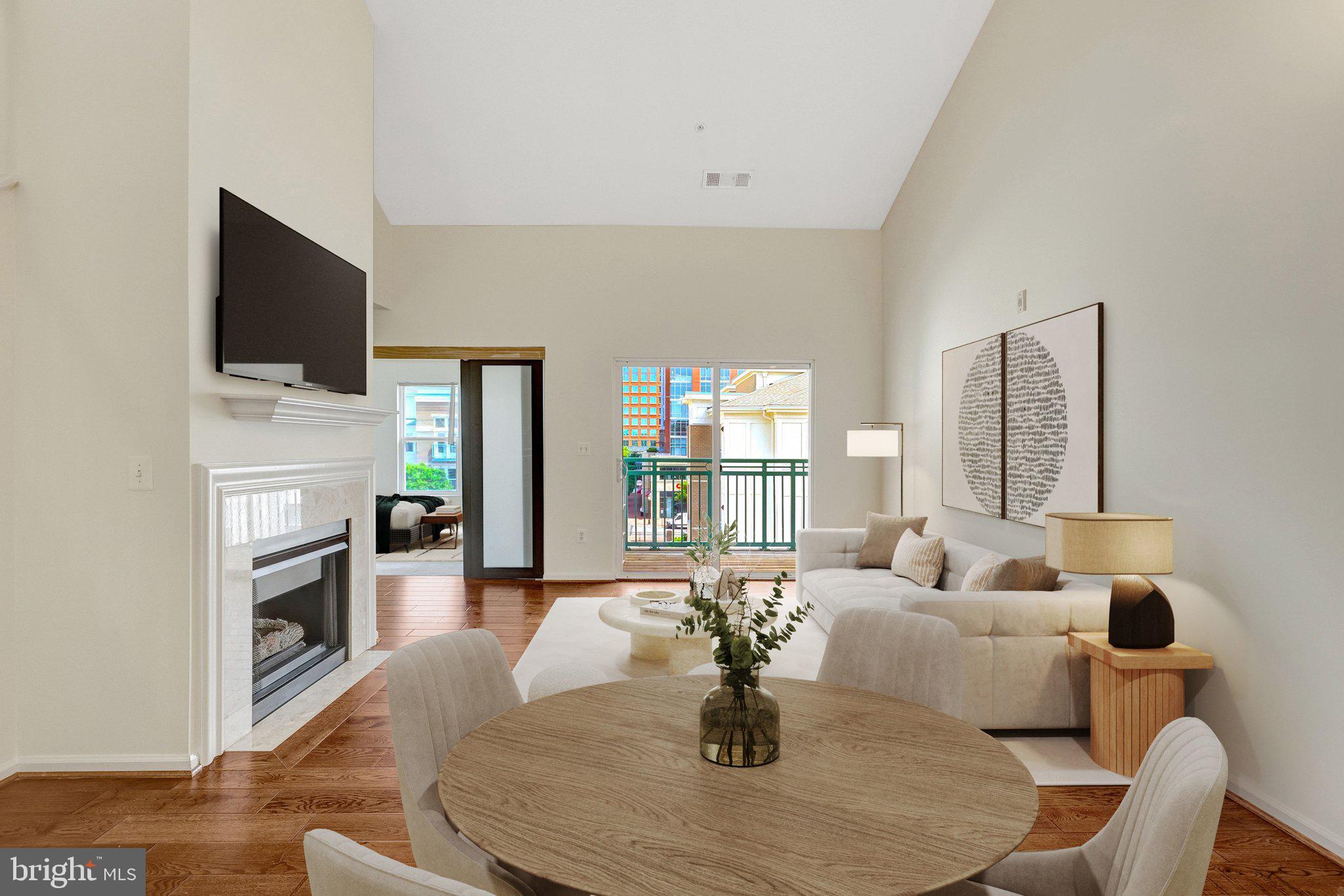 Experience elevated penthouse living in the heart of Reston Town Center. This beautifully updated Freshly Painted two-level condo 2 Garage Spaces, Features gleaming updated hardwood floors, an upgraded kitchen, newer HVAC, soaring cathedral ceilings, and abundant natural light throughout.HVAC 2018,Hardwood Floor and Granite 2019, Dishwasher 2020 Paint 2026
The open floor plan offers an effortless flow, with a welcoming foyer, extra closet space, and a convenient laundry closet. The great room is anchored by a cozy gas fireplace and opens to a spacious balcony—perfect for relaxing or entertaining.
The main level includes a spacious, sun-filled den/bedroom, while the upper level offers a private second primary suite with a full bath, ideal for guests, privacy, or flexible living.GARAGE ELEVATOR CONVENIENTLY LOCATED STEPS AWAY FROM THE UNIT. 
Enjoy the best of Reston Town Center living, just steps from shops, restaurants, and movie theaters. Community amenities include a party room, fitness center, pool, and concierge service.
Includes two garage parking spaces: UL309 and UL310.
