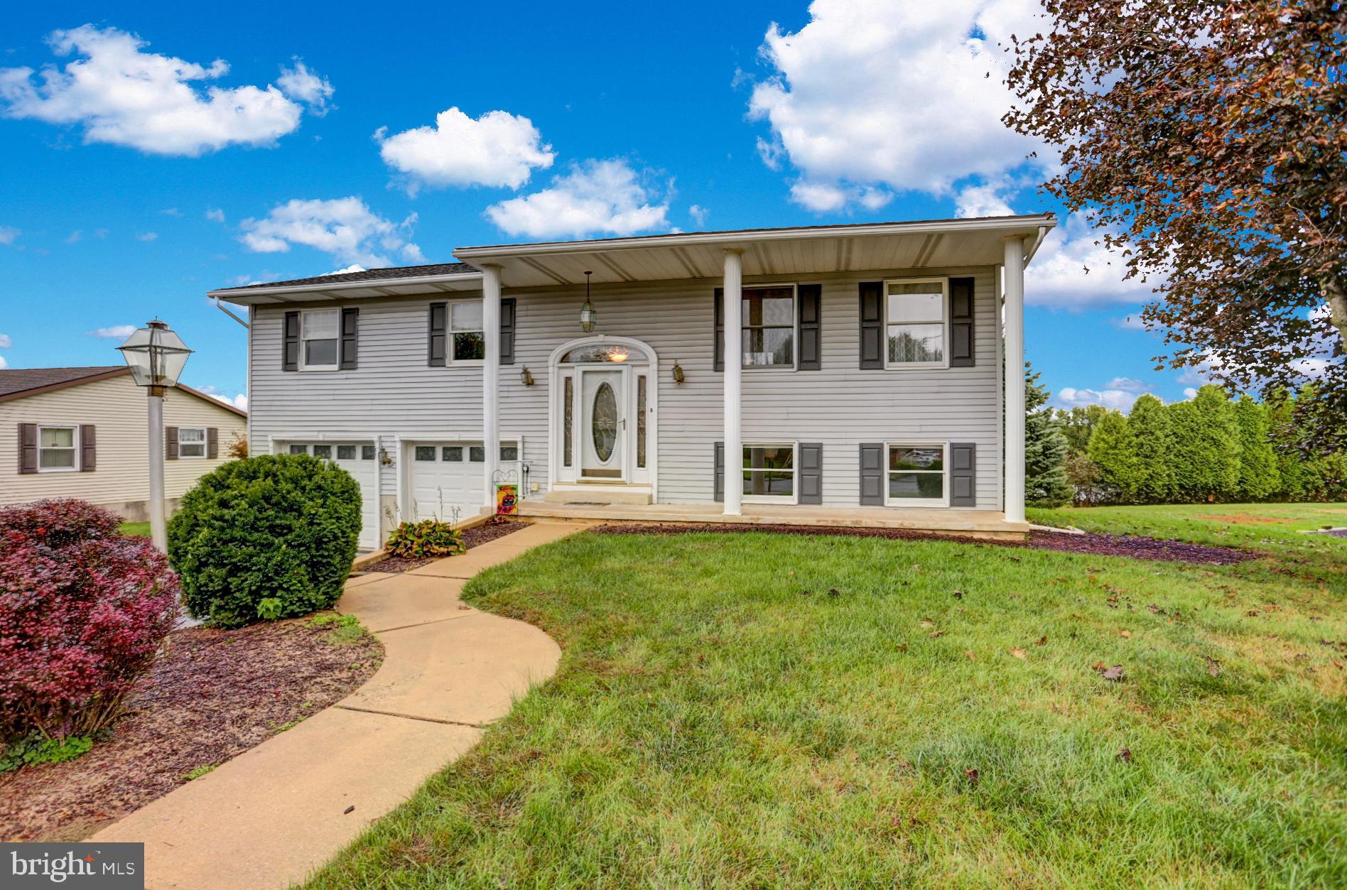 Located near the end of a cul-de-sac on a low traffic street is where you ll find this nicely updated 4-bedroom home.  The 2 story pillars give this home a stately look.  Inside you ll find an open floor plan and plenty of windows for natural light and nearly every room recently painted in a current color scheme.  The living room flows into the dining room with a door out to a large deck with spectacular views.  Back inside the dining room opens nicely into an updated kitchen with stainless steel appliances and granite countertops with bar seating and plenty of storage space.  Down the hall is the newly updated full bath with access to the large master bedroom.  There are 2 more bedrooms on this level, one currently used as closet.  Downstairs is equally impressive with a large family room and 4th bedroom (currently used as an office) with direct access to another full bath that has also recently been updated.  You might actually look forward to doing laundry in this laundry room!  It is large and offers ample counter space to fold clothing and plenty of cabinets for storage as well as hanging racks.  There is also a door which leads out to a covered patio under the deck.  The yard is the perfect size to entertain and was once home to an above ground pool which means that area is level and ready for a new pool if you so desire.   There is also an oversized 2-car garage and a new energy efficient heat pump with a transferable warranty.  Hurry!  This one shows well!